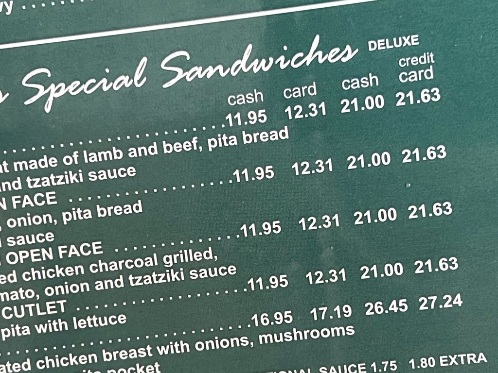 Special measures: Restaurant menu in Oyster Bay showing dual pricing