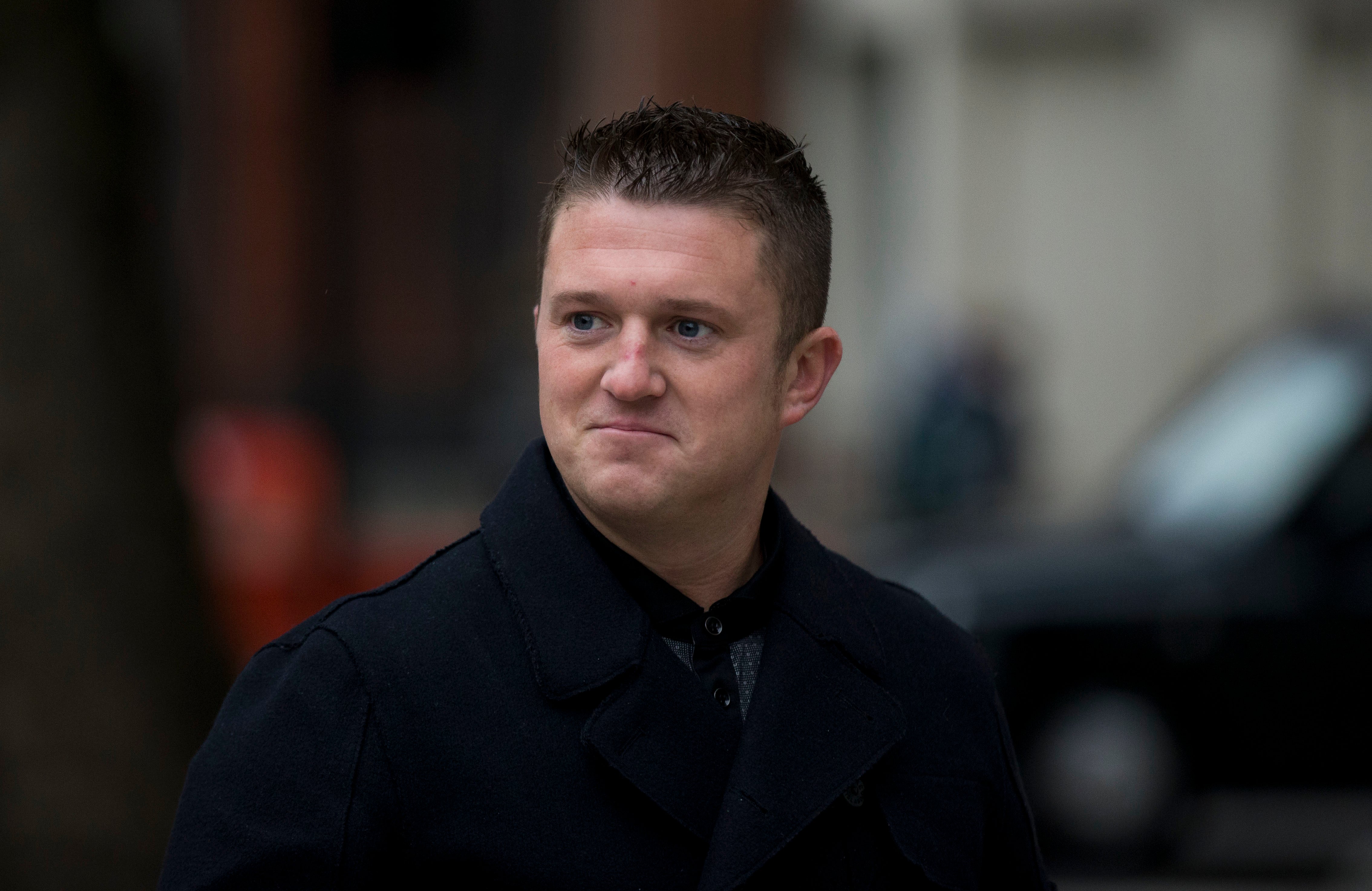 Tommy Robinson has been charged with harassment causing fear of violence against two men