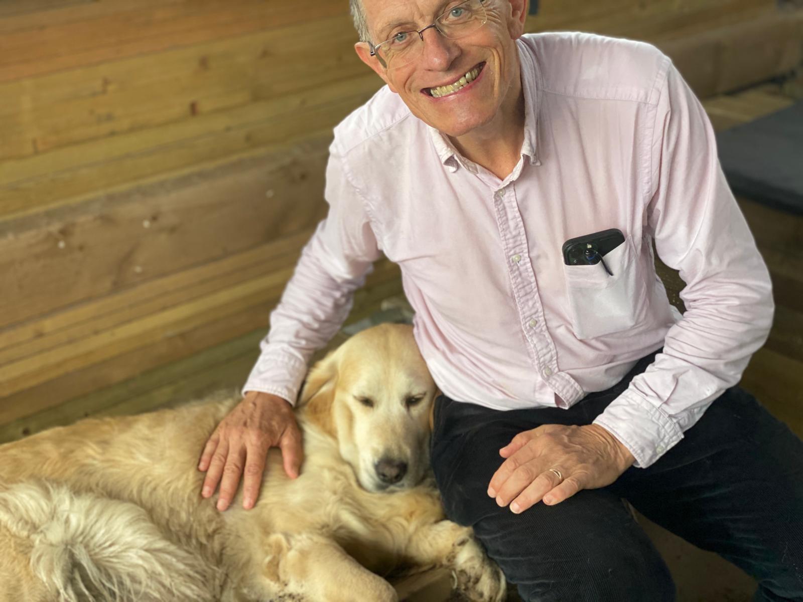Man's best friend: Simon Calder with golden retriever