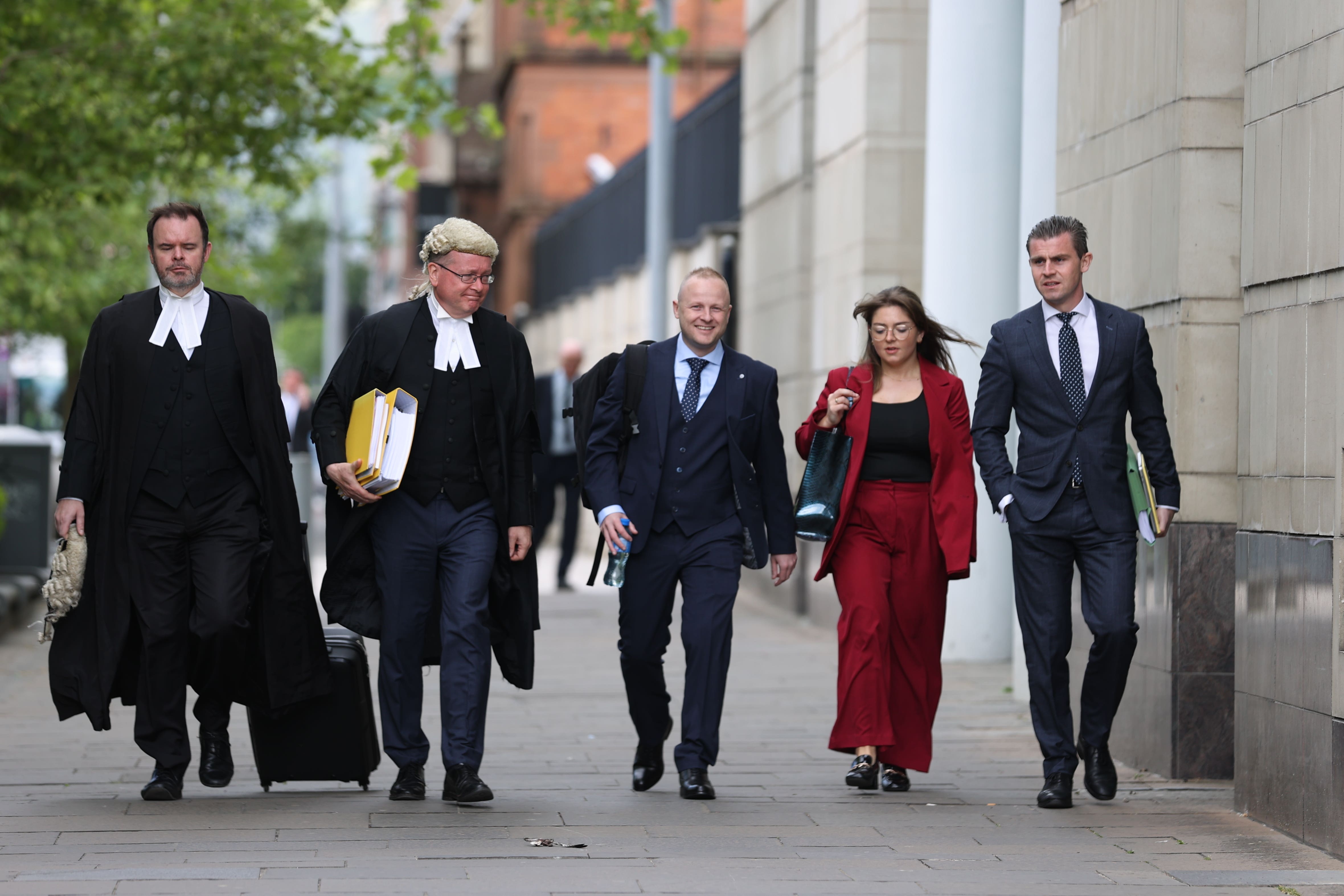 (left to right) Joseph O’Keefe KC, John Larkin KC, defendant Jamie Bryson, Megan Burns and Darragh Mackin of Phoenix Law arrive at Belfast Crown Court on Monday (Liam McBurney/PA)