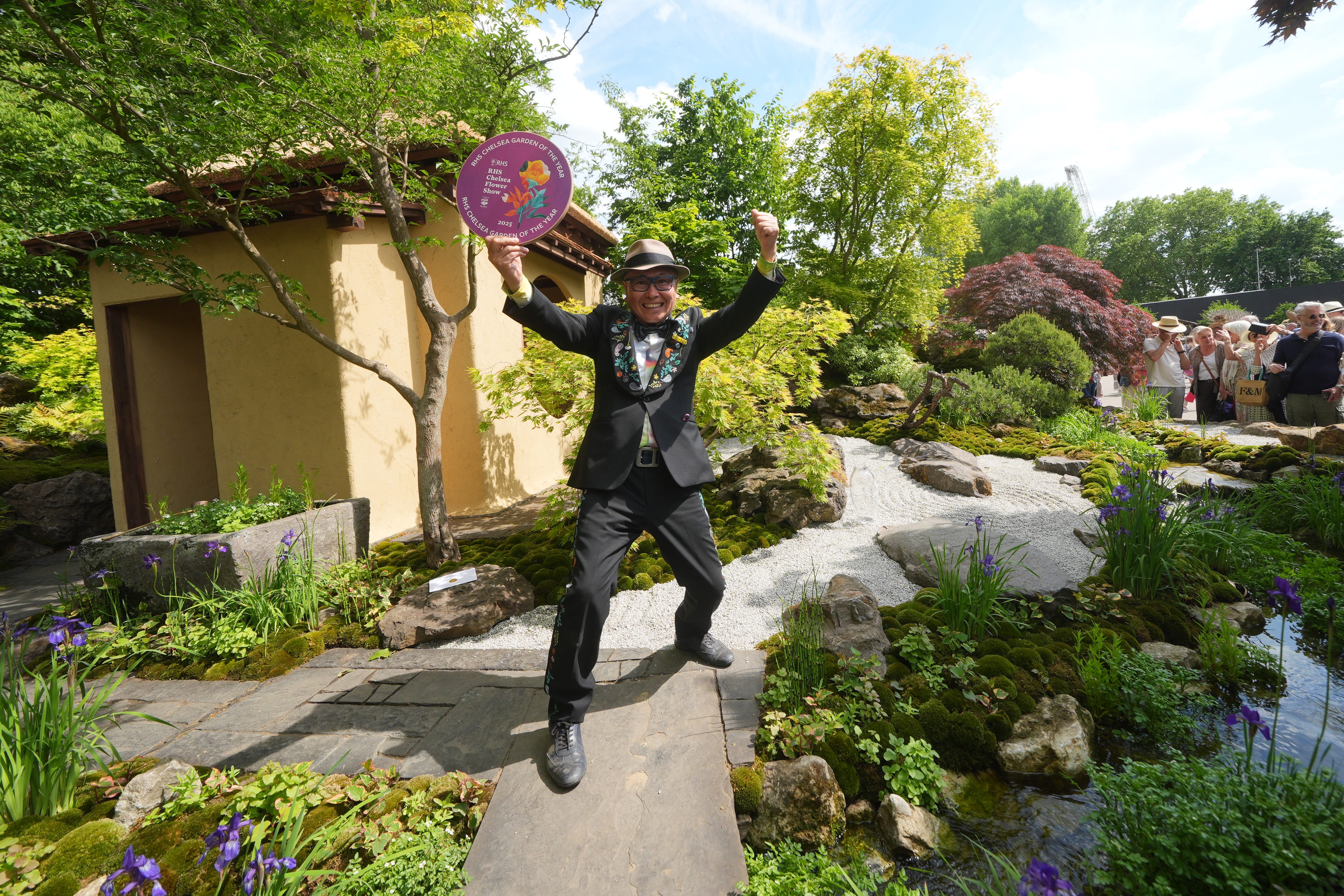 Kazuyuki Ishihara celebrated winning the RHS Chelsea garden of the year award (Yui Mok/PA)