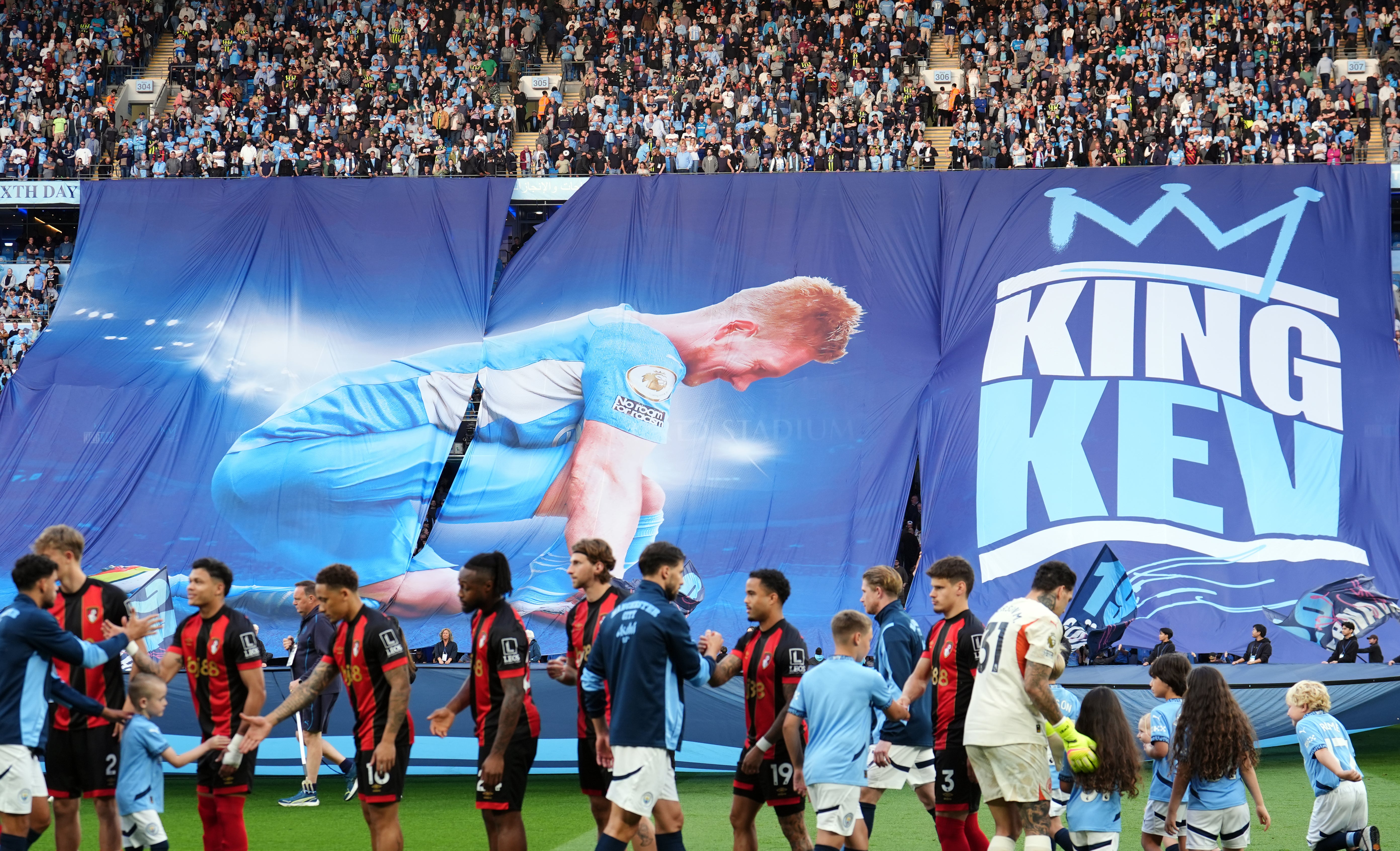 Manchester City fans display a banner of Kevin De Bruyne ahead of his final home appearance