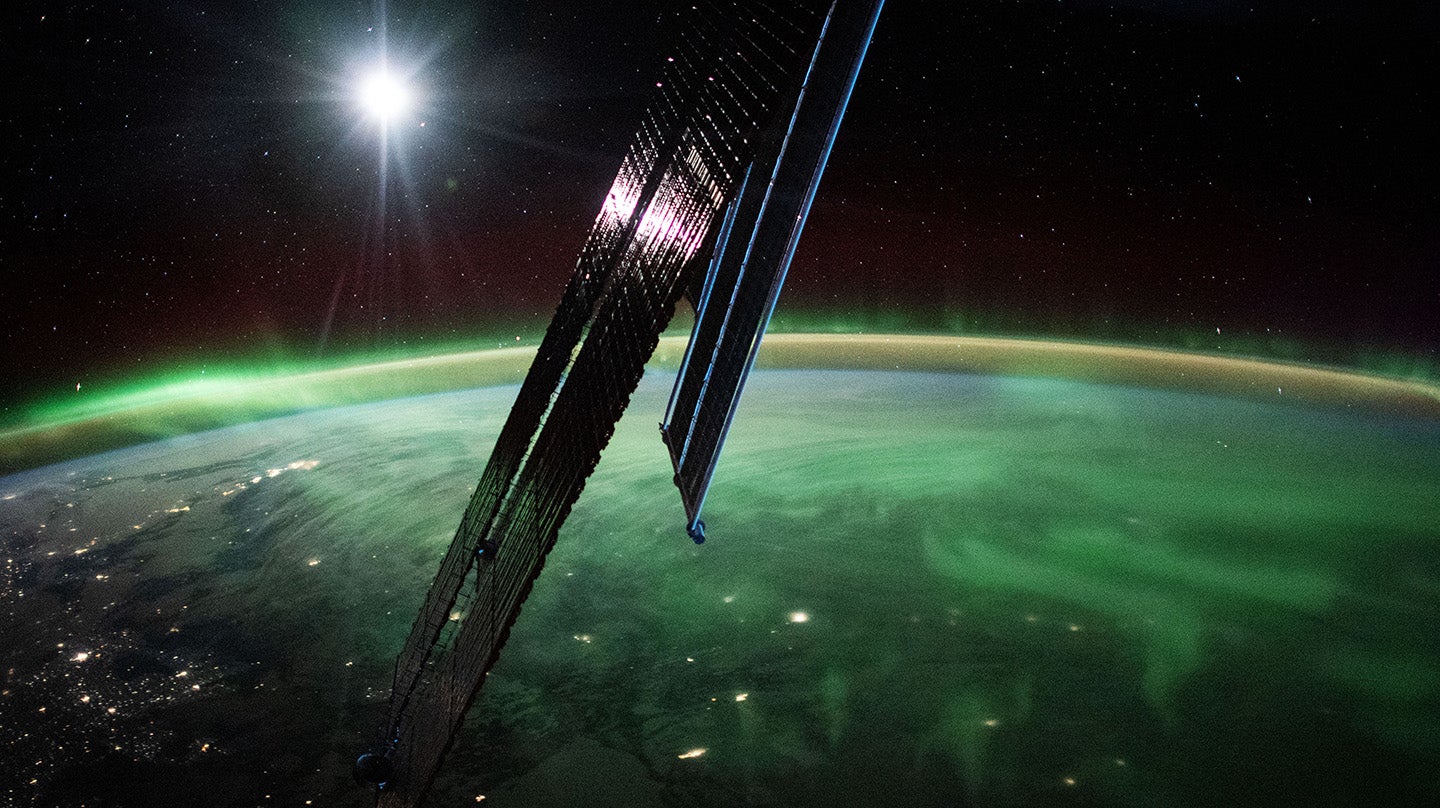 Photo taken from the International Space Station of the aurora borealis streaming above southeastern Manitoba