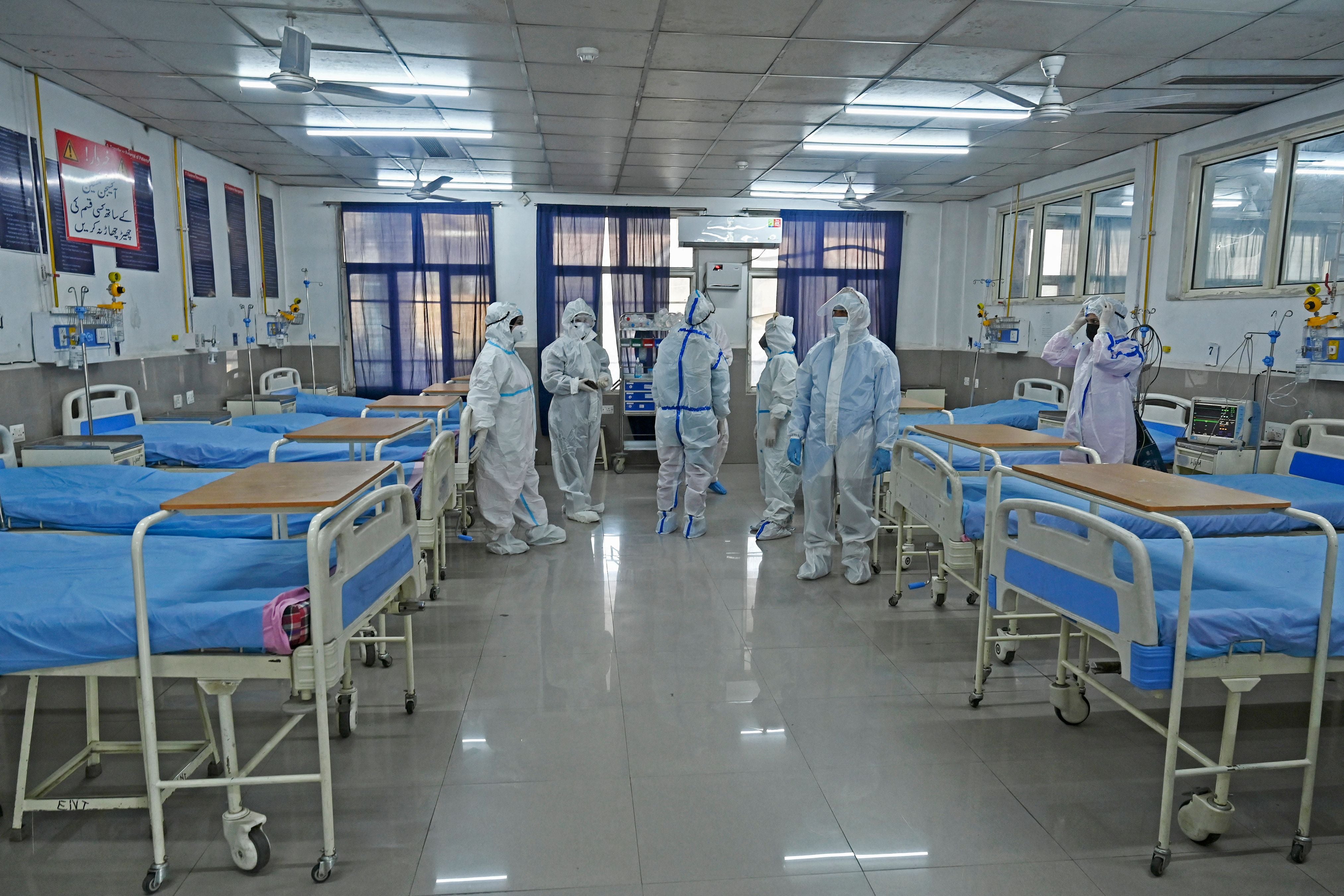 Health workers wearing personal protective equipment (PPE) take part in a mock drill to check preparations of Covid-19 facilities at JLNM hospital in downtown Srinagar on 10 April 2023