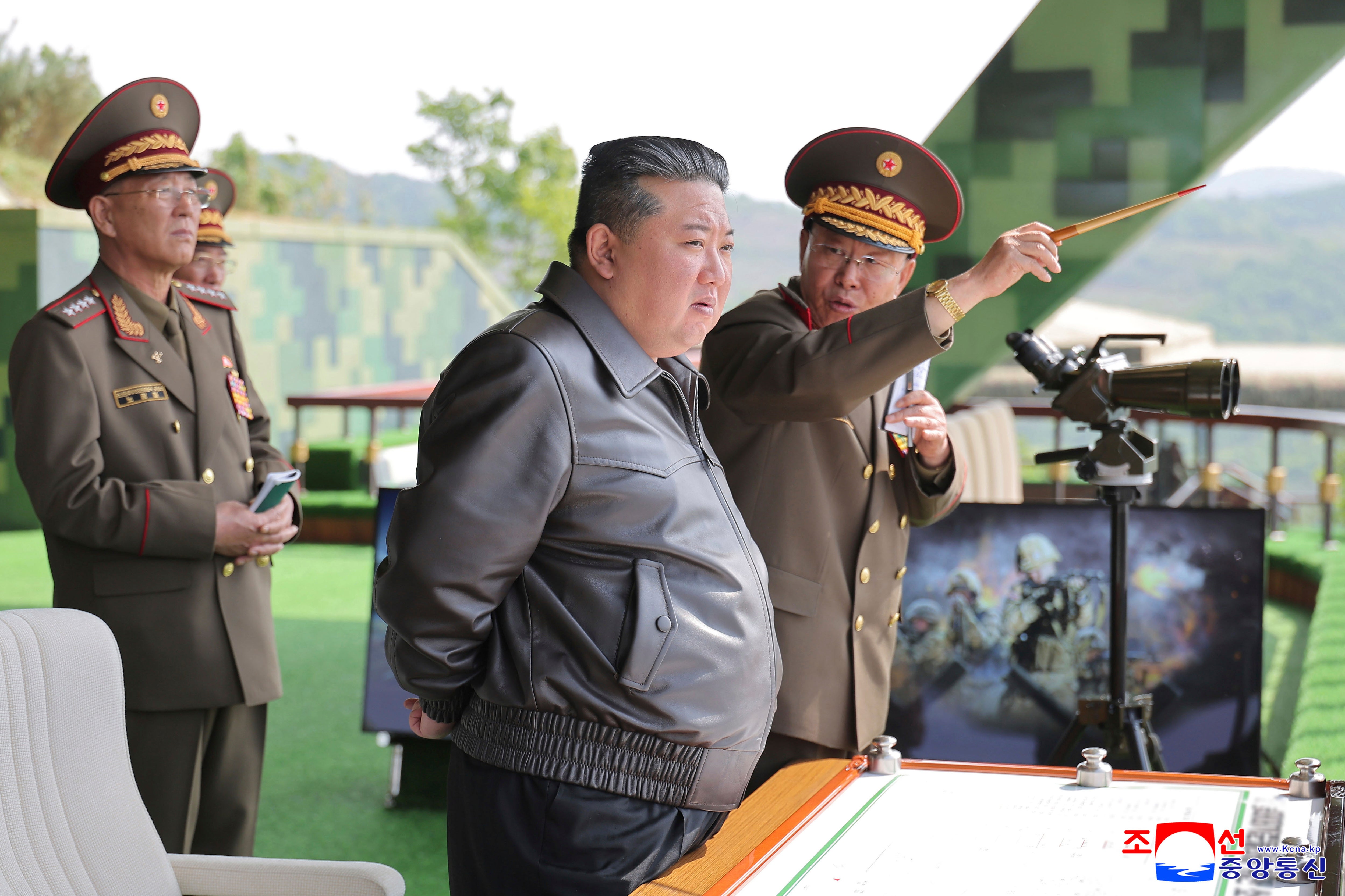 North Korean government, North Korean leader Kim Jong Un, center, inspects the military exercises at an undisclosed place in North Korea, Tuesday, May 13, 2025