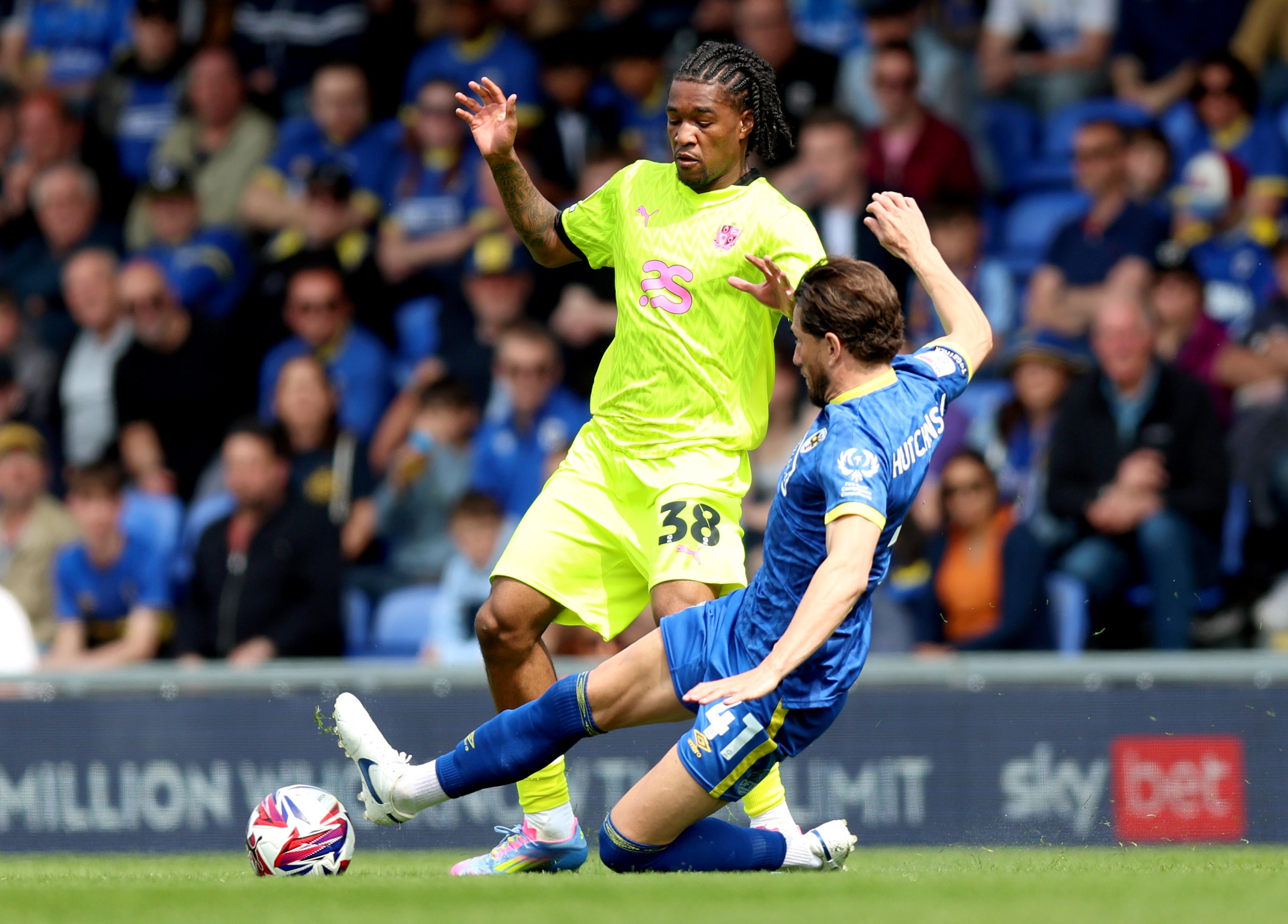AFC Wimbledon's Sam Hutchinson has undergone surgery to place a stent in a blocked artery after he fell ill