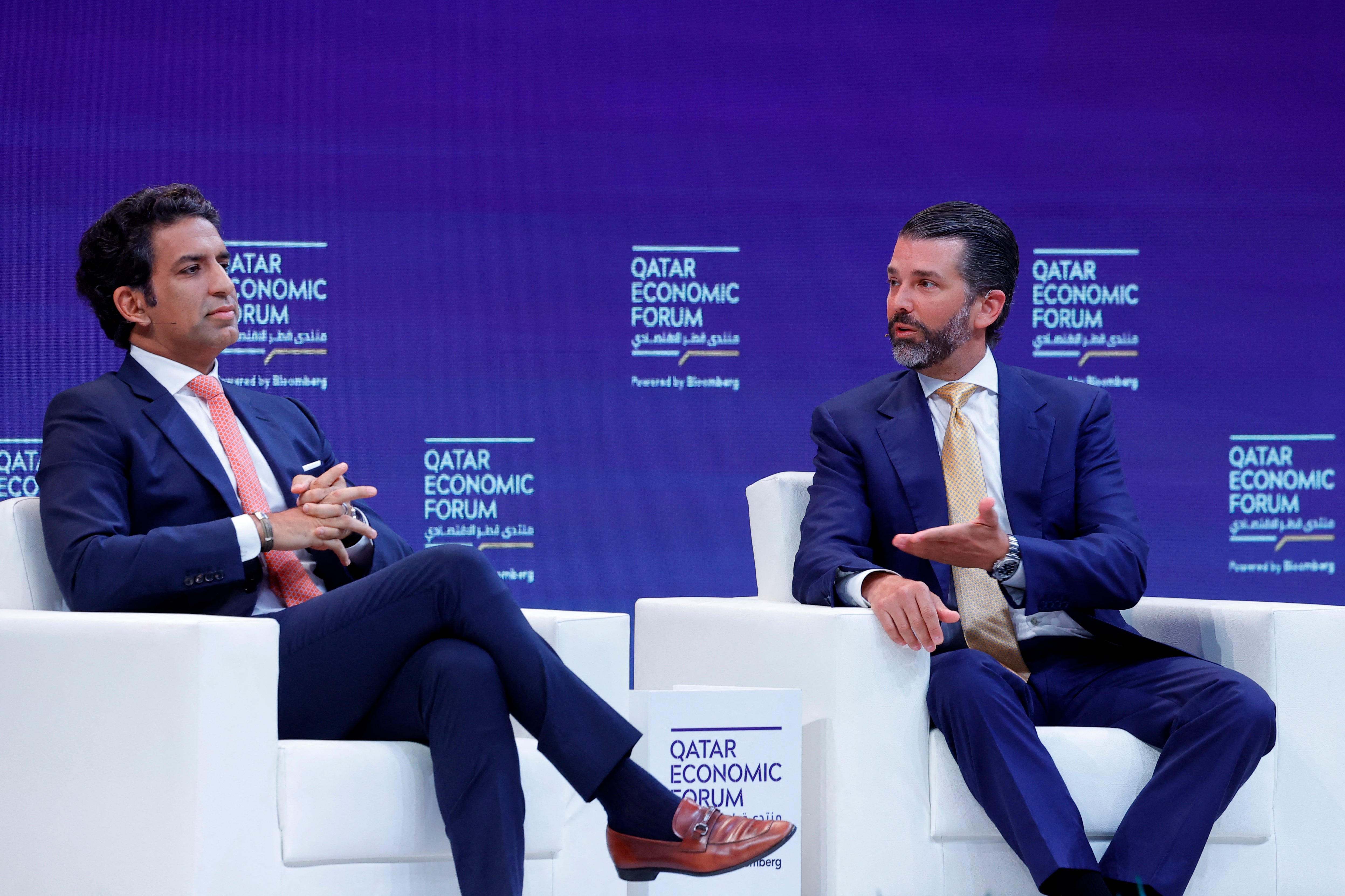 Donald Trump Jr. and Executive Branch co-owner Omeed Malik talk during a session in the Qatar Economic Forum in Doha