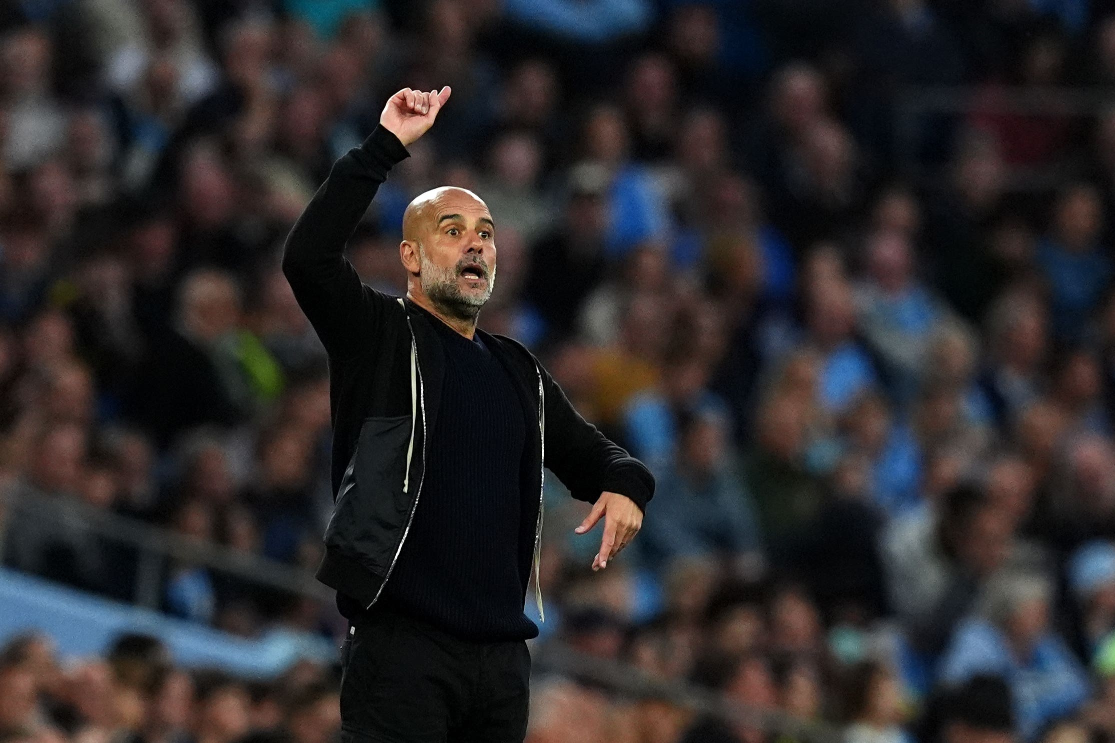 Manchester City manager Pep Guardiola wants his side to end a tough season with Champions League qualification (Martin Rickett/PA).