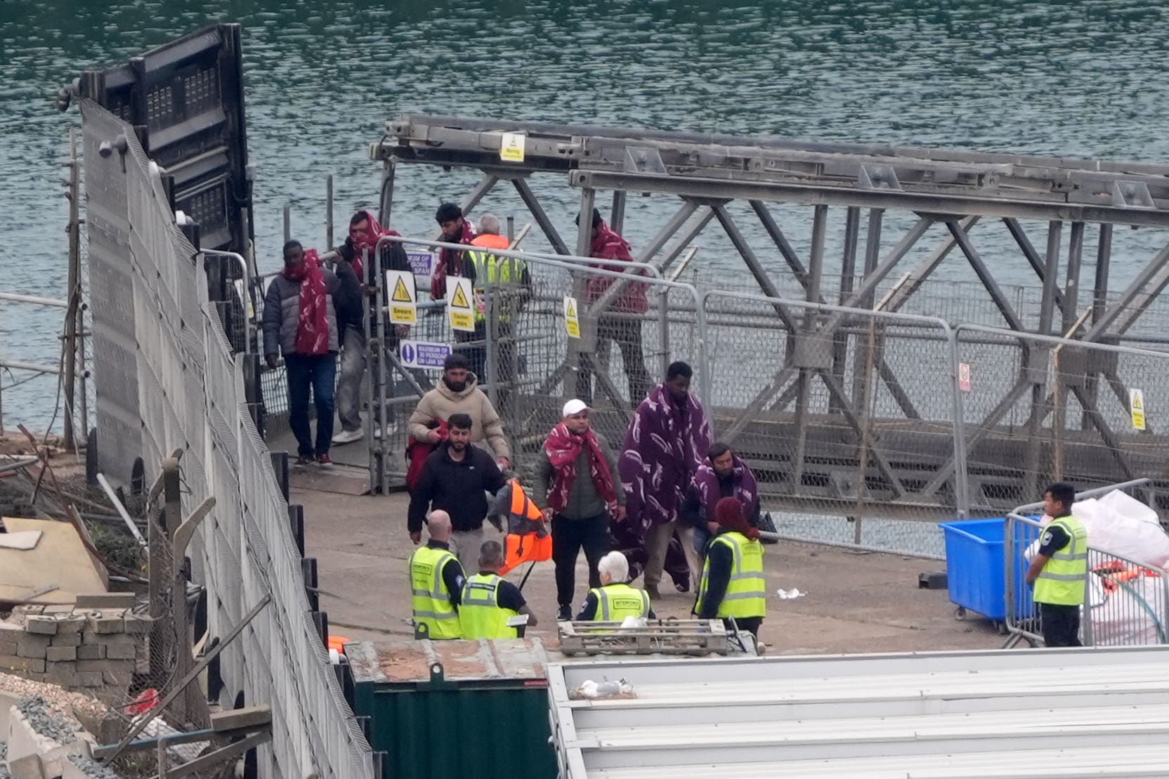 A group of people thought to be migrants are brought in to Dover, Kent, from a Border Force vessel following a small boat incident in the Channel (Gareth Fuller/PA)