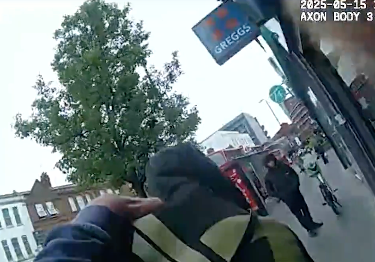 An undercover officer grabs Verry from behind before throwing him to the floor