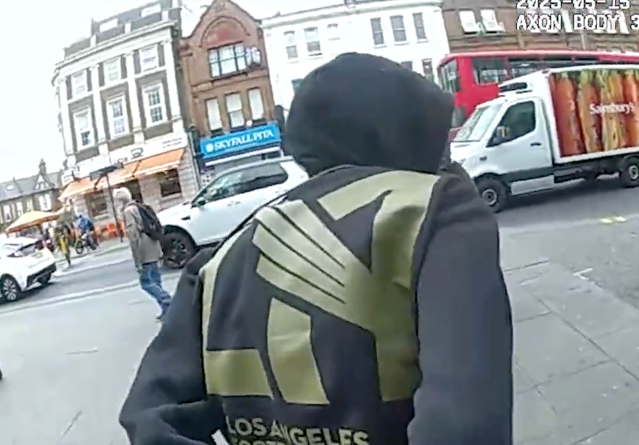 Patrick Verry is led from Greggs in handcuffs