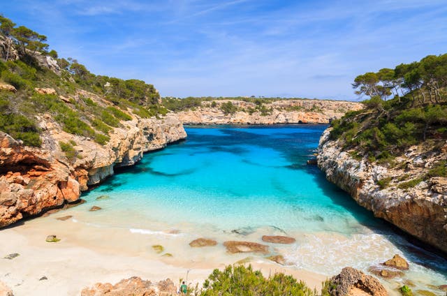 <p>Caló des Moro beach in Mallorca is home to clear turquoise water and powder-soft sand</p>