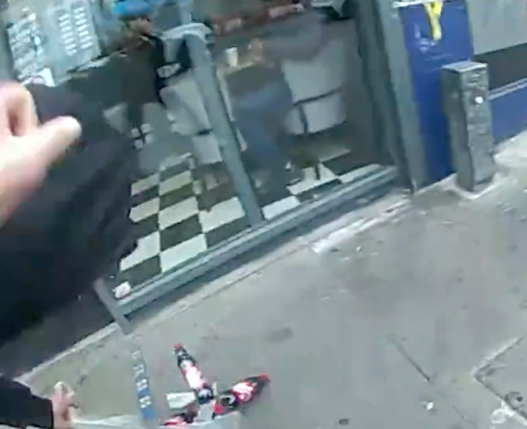 Bottles of soft drink roll out of Patrick Verry's bag as he is tackled