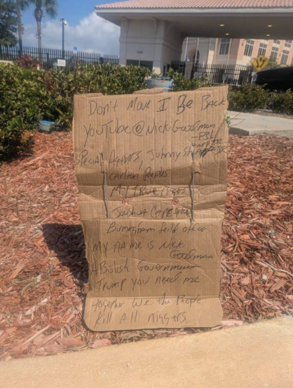 The cardboard sign found outside the FBI's field office in Tampa, Florida