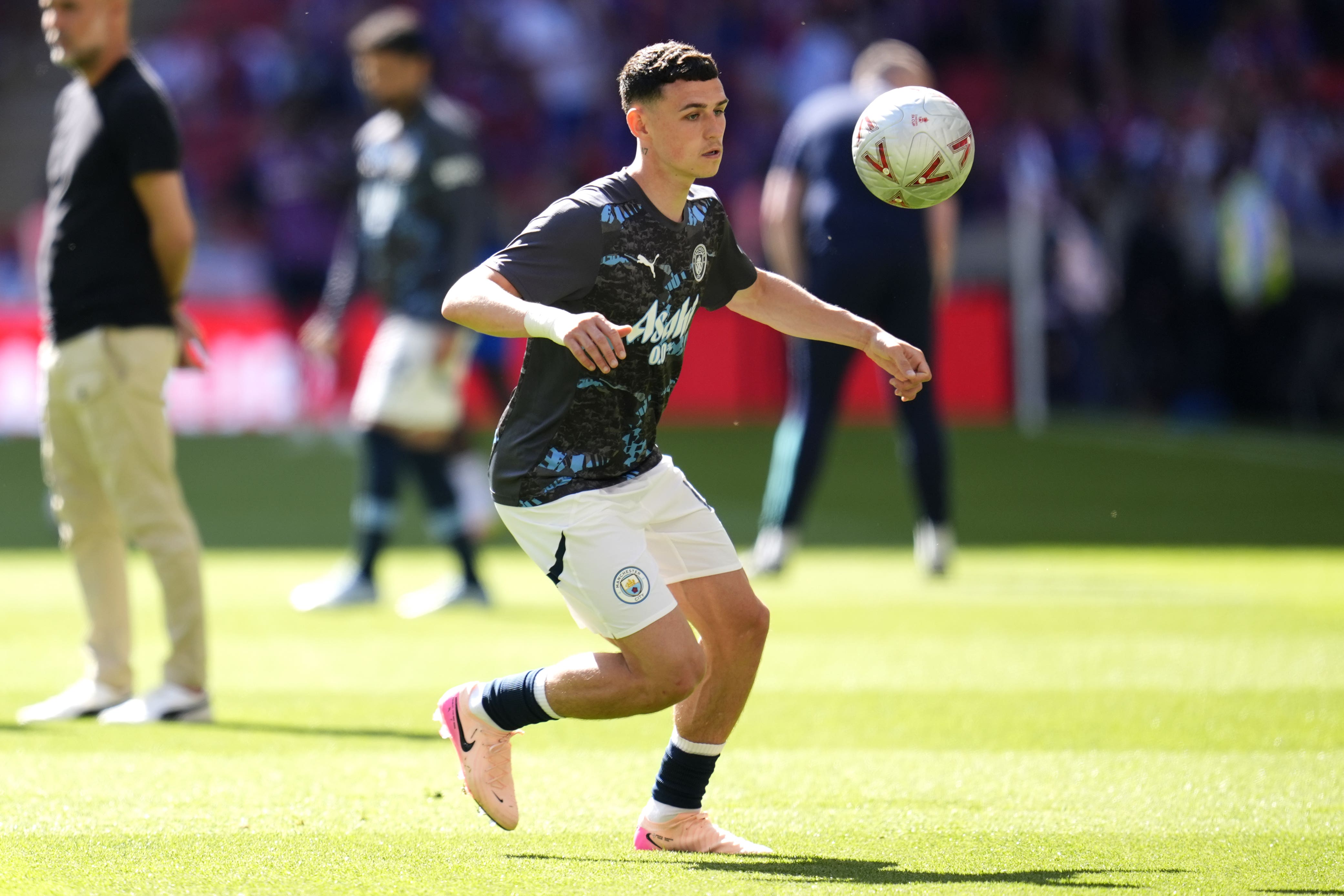 Manchester City’s Phil Foden warming up ahead of the FA Cup final (Nick Potts/PA)