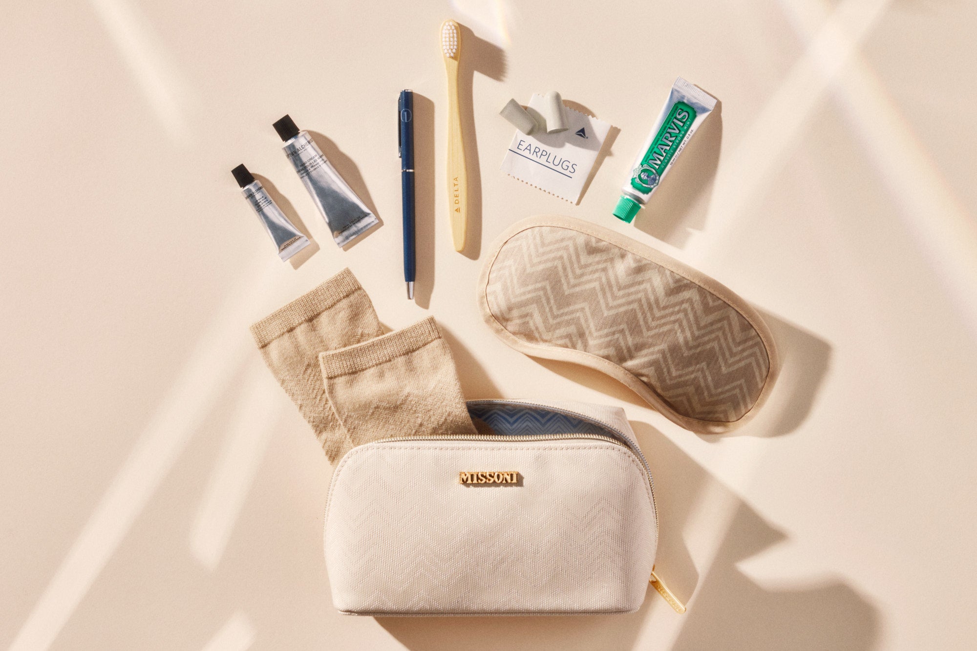 The new amenity kits will include socks; a breathable eye mask; an 'upgraded' pen featuring 'metal accents'; Grown Alchemist skincare products in 'elevated aluminum tubes'; a bamboo toothbrush; Marvis toothpaste; and earplugs