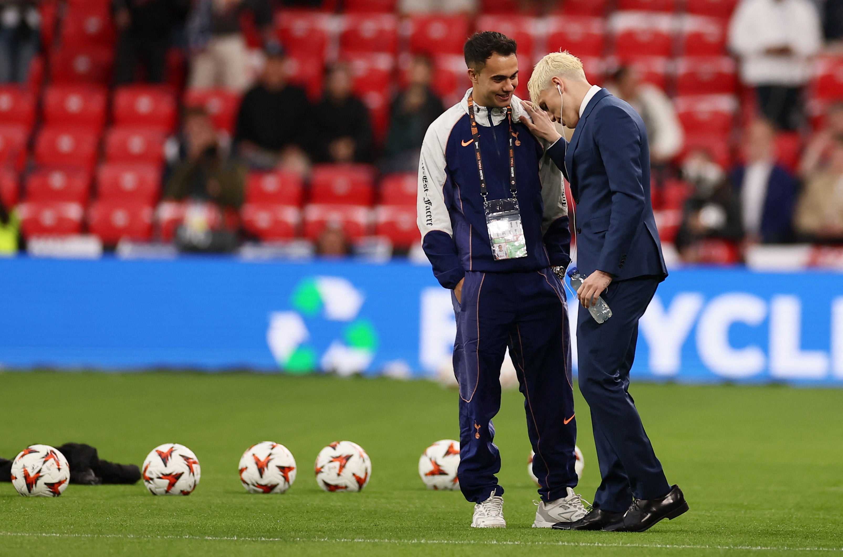 Manchester United's Alejandro Garnacho chats to Tottenham Hotspur's Sergio Reguilon on the pitch