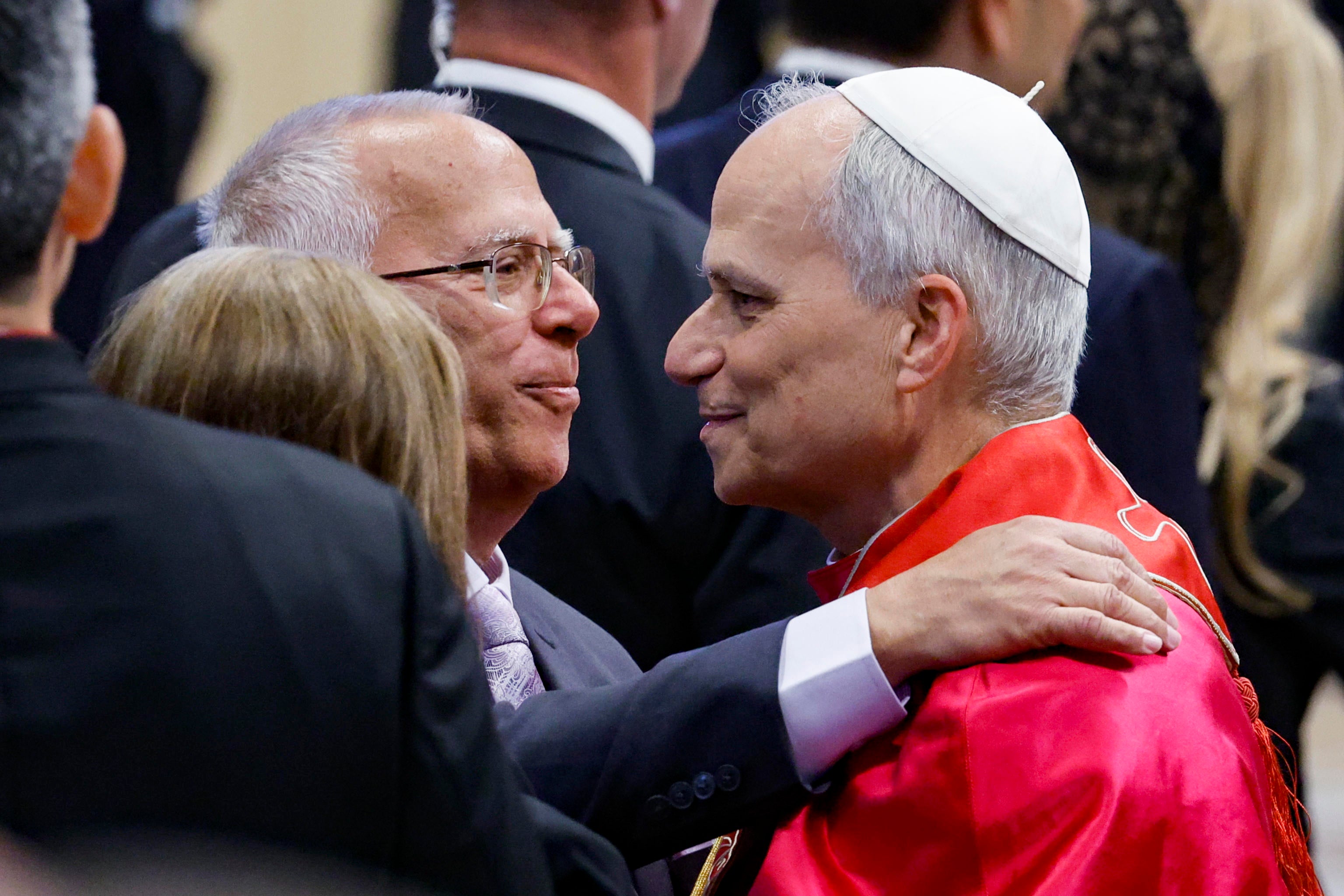 Pope Leo XIV (right) greets his brother Louis Prevost at the end of the Holy Mass in St Peter’s Square on Sunday