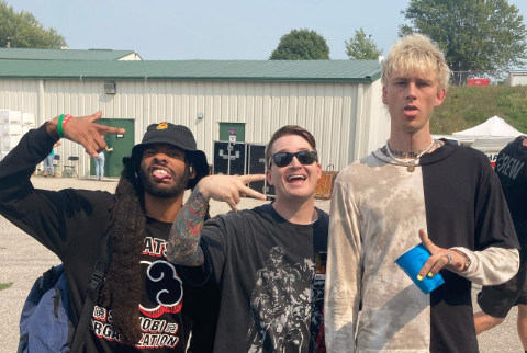 Adam Ramey of the Dropout Kings (pictured centre, with his bandmate Eddie Wellz, left, and Machine Gun Kelly)