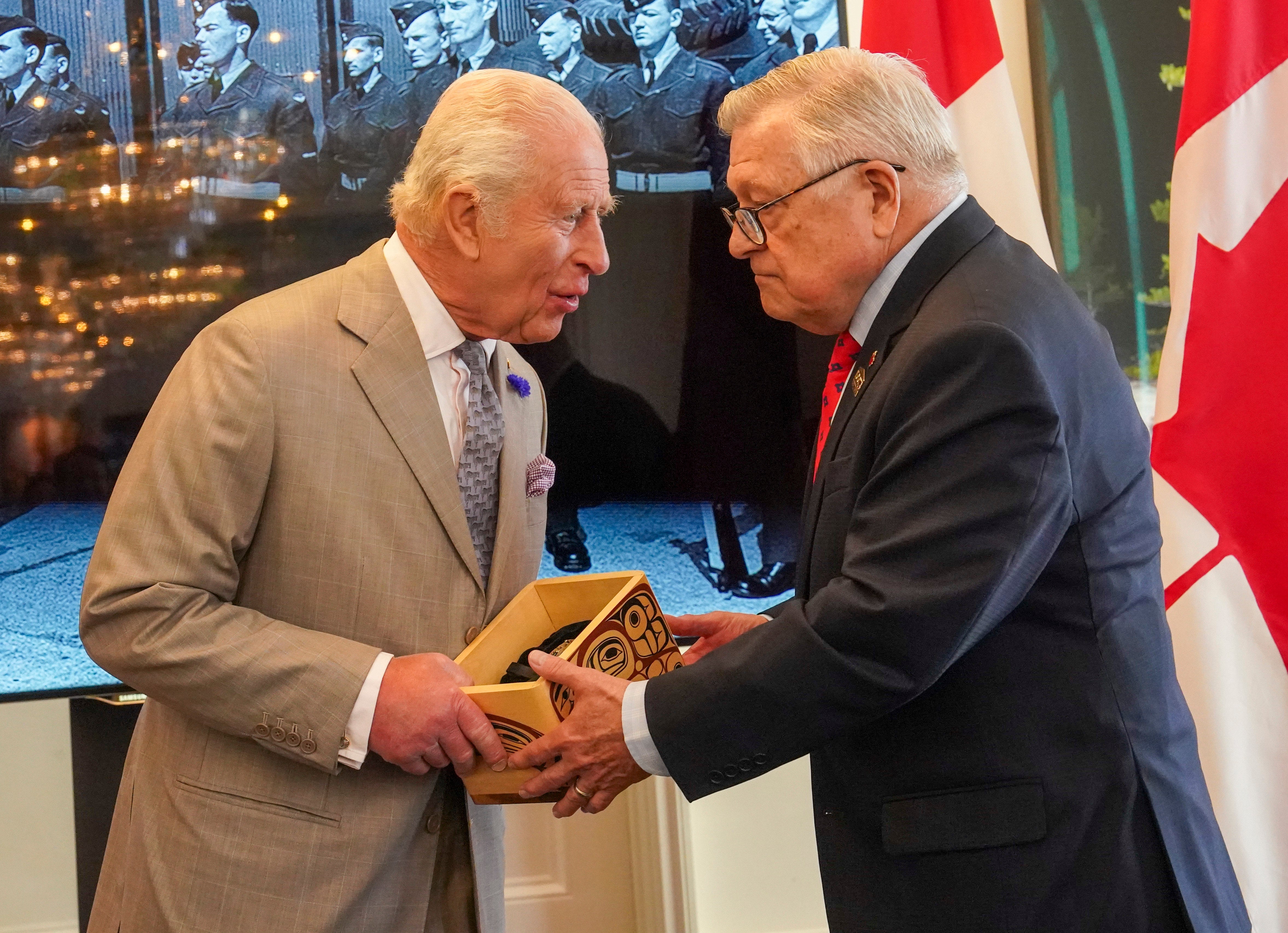 The monarch is presented with the Key to Canada House by High Commissioner for Canada, Ralph Goodale
