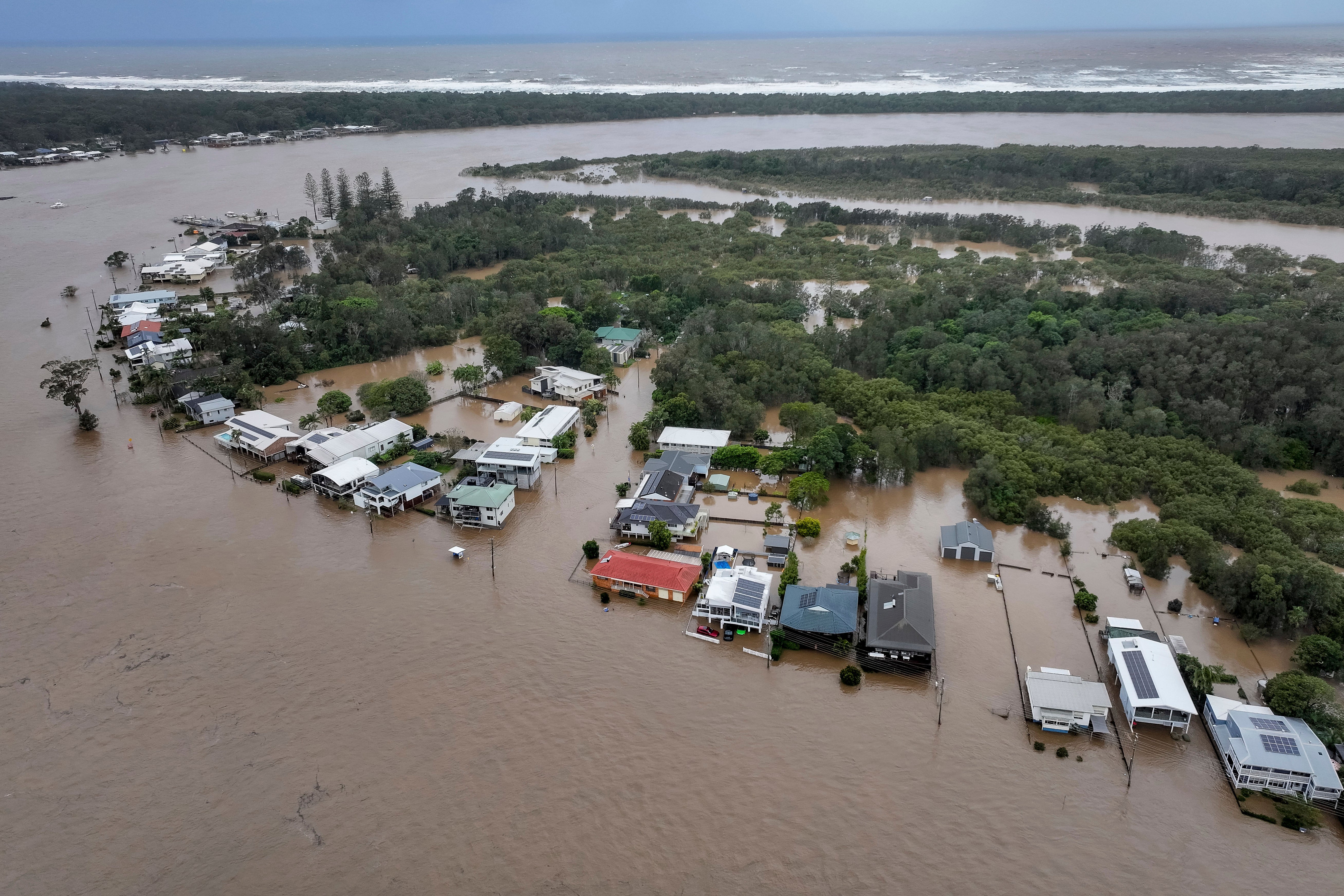Flood waters surround houses in Port Macquarie, north of Sydney, Australia, Thursday, May 22, 2025