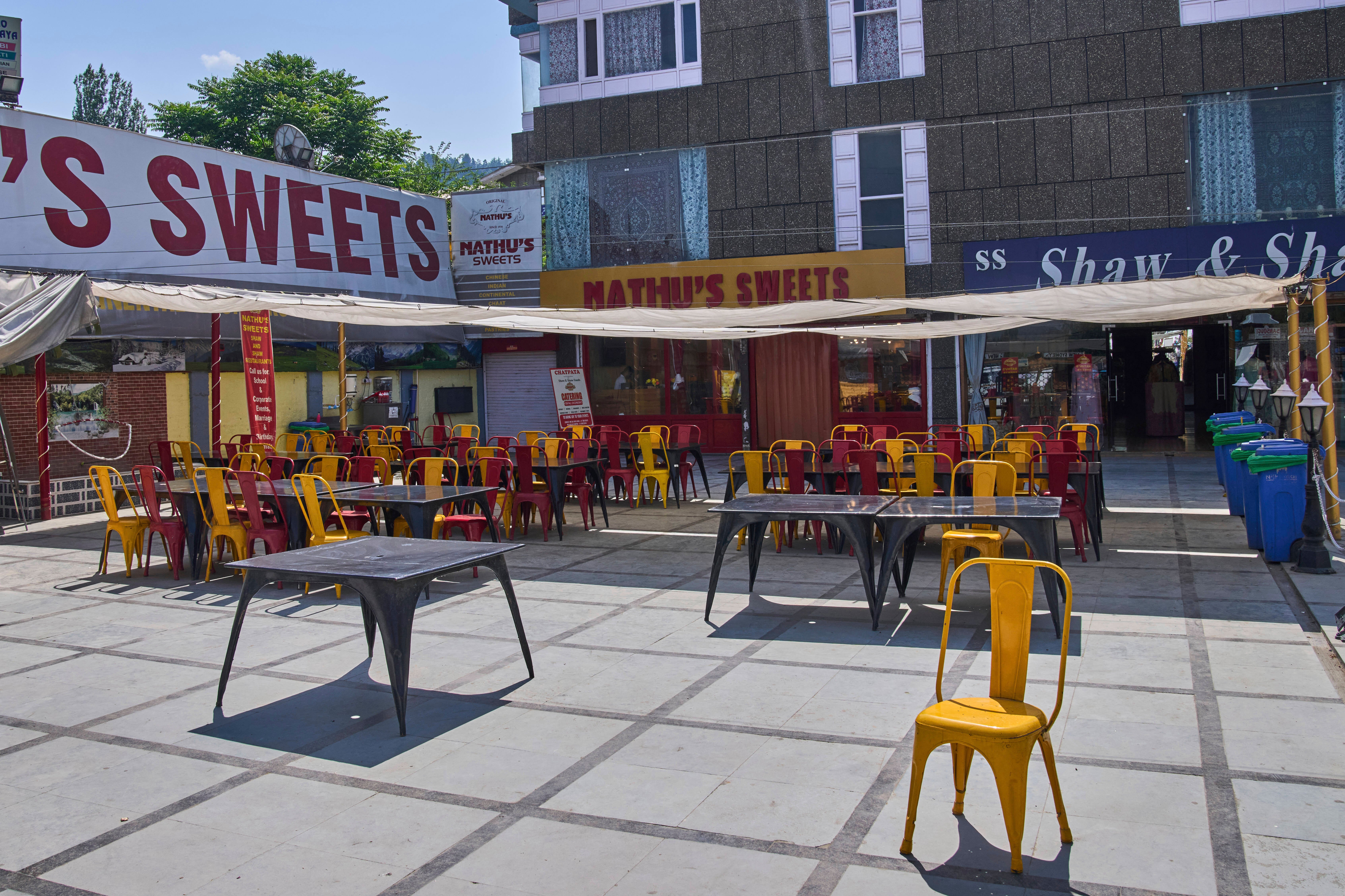 Empty tables and chairs outside a restaurant near Dal Lake in Srinagar, Indian controlled Kashmir, India