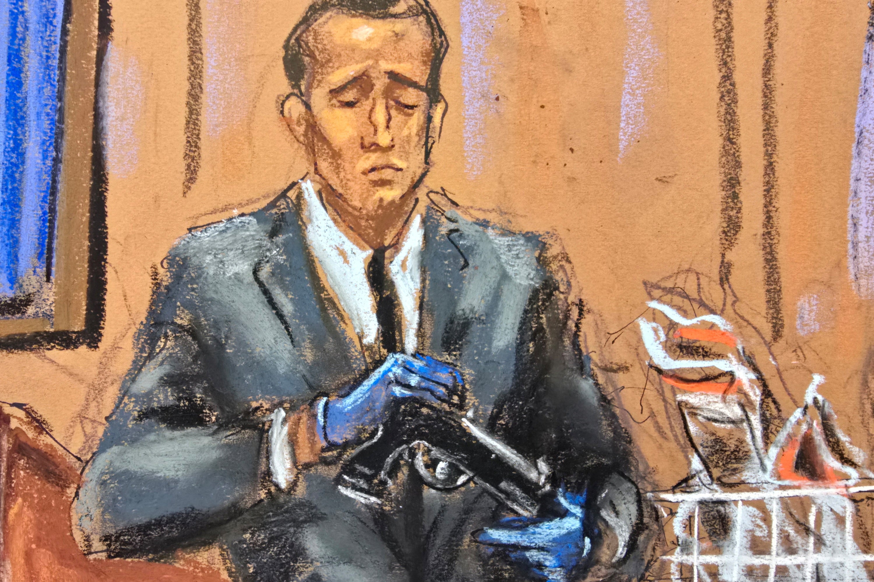 Homeland Security Investigations Special Agent Gerard Gannon shows a firearm recovered from Diddy's Miami home to the jury on Wednesday