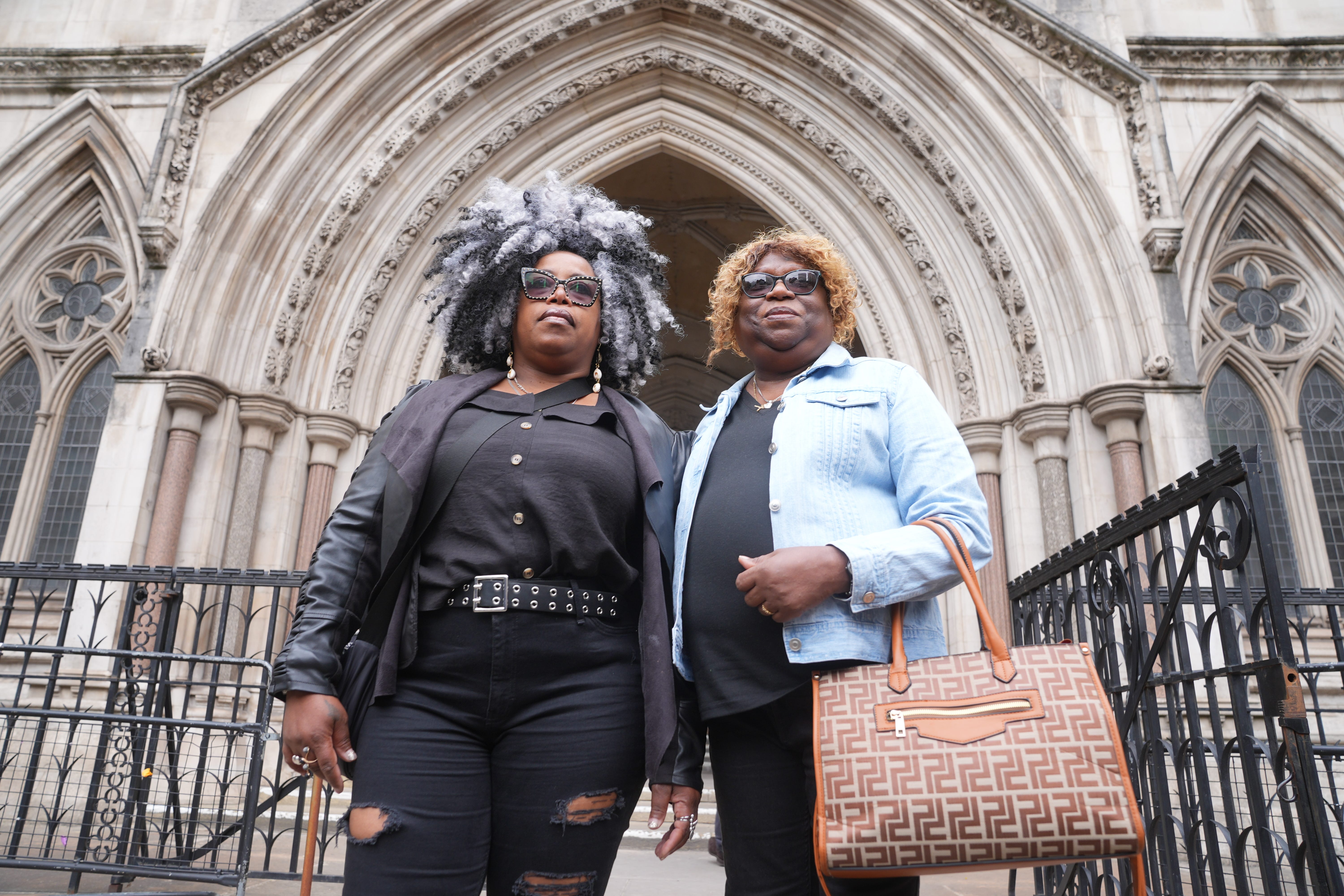 Bertice Pompe (left) and Bernadette Dugasse outside the High Court in central London