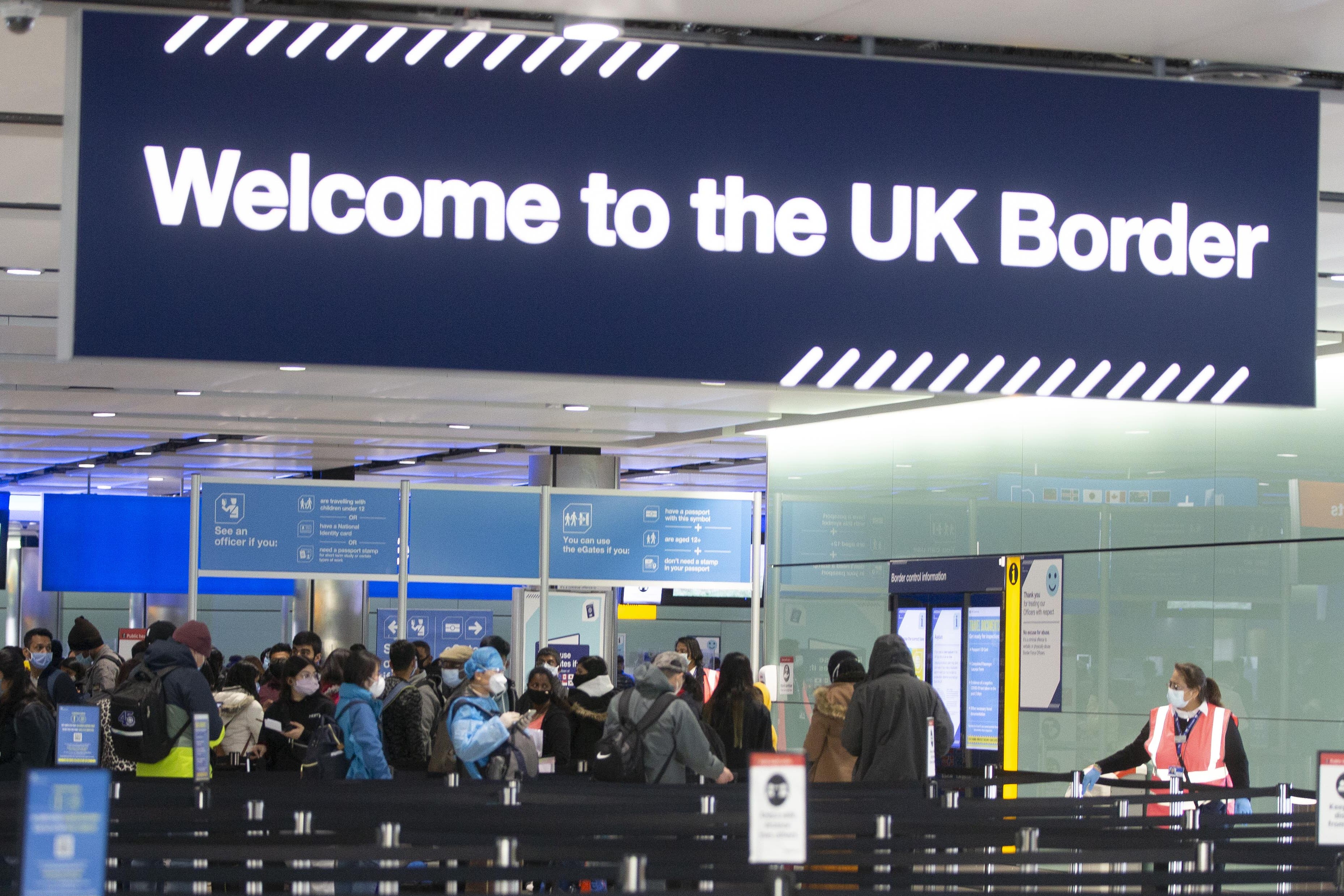 Net migration to the UK is estimated to have halved between 2023 and 2024 (Ian Vogler/PA)