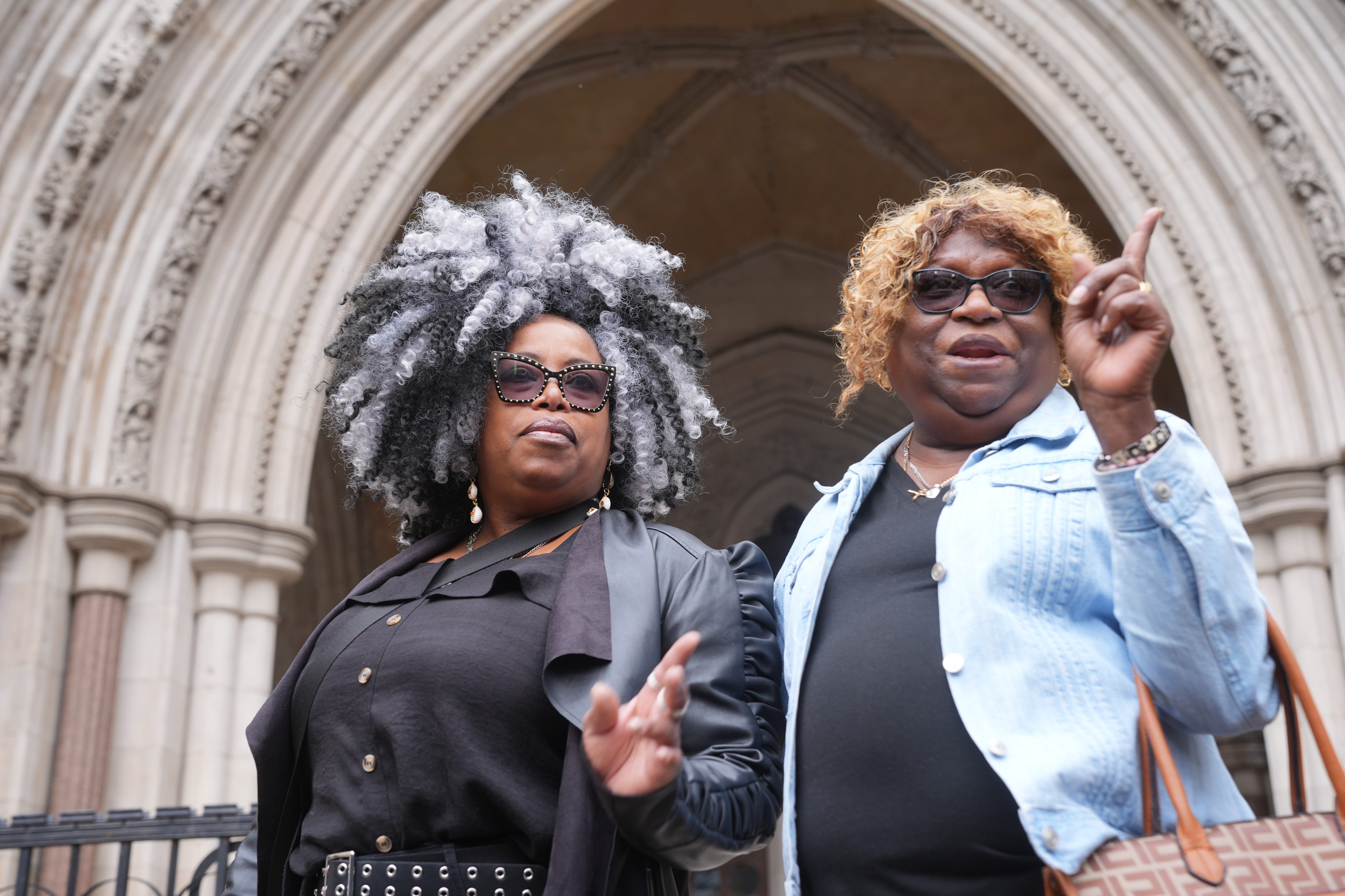 Bertice Pompe (left) and Bernadette Dugasse outside the High Court in central London (Yui Mok/PA)