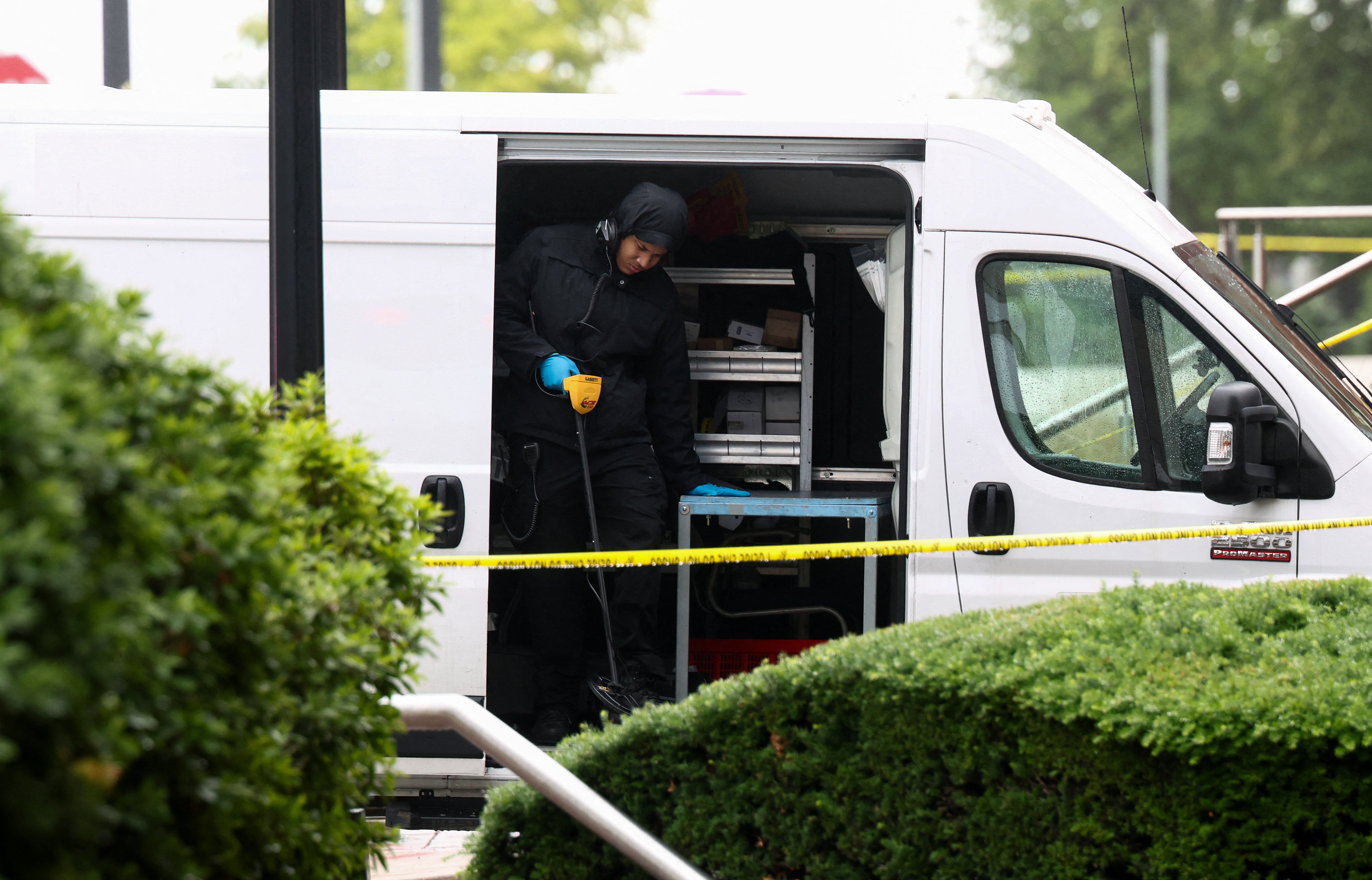 A technician stands in a forensic evidence crime scene van near the place where, according to the U.S. Homeland Security Secretary, two Israeli embassy staff were shot dead near the Capital Jewish Museum in Washington, D.C.