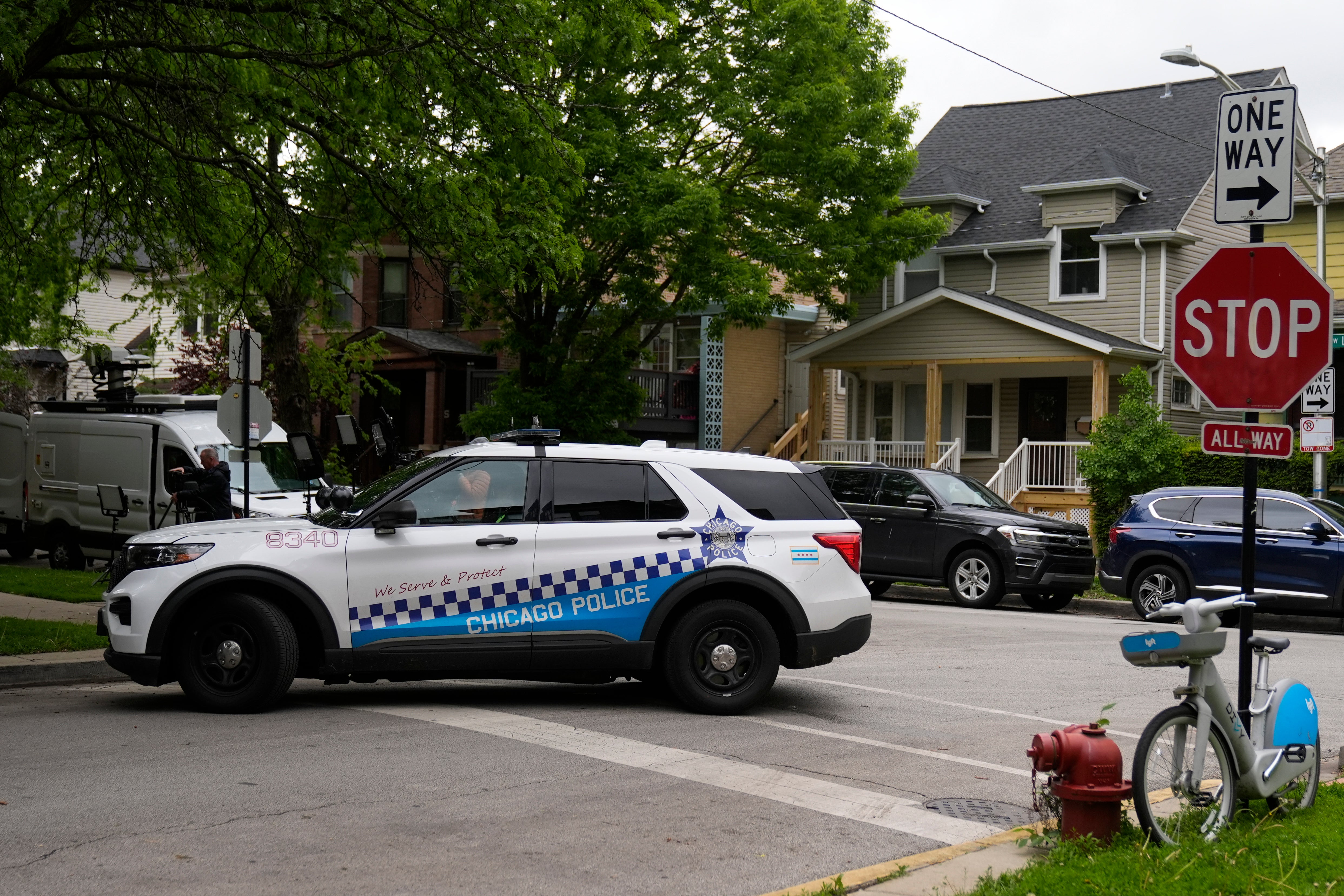 A Chicago police vehicle is parked near an address listed in public records as the home of Elias Rodriguez, who police identified as the suspect in the killing of two staff members of the Israeli Embassy