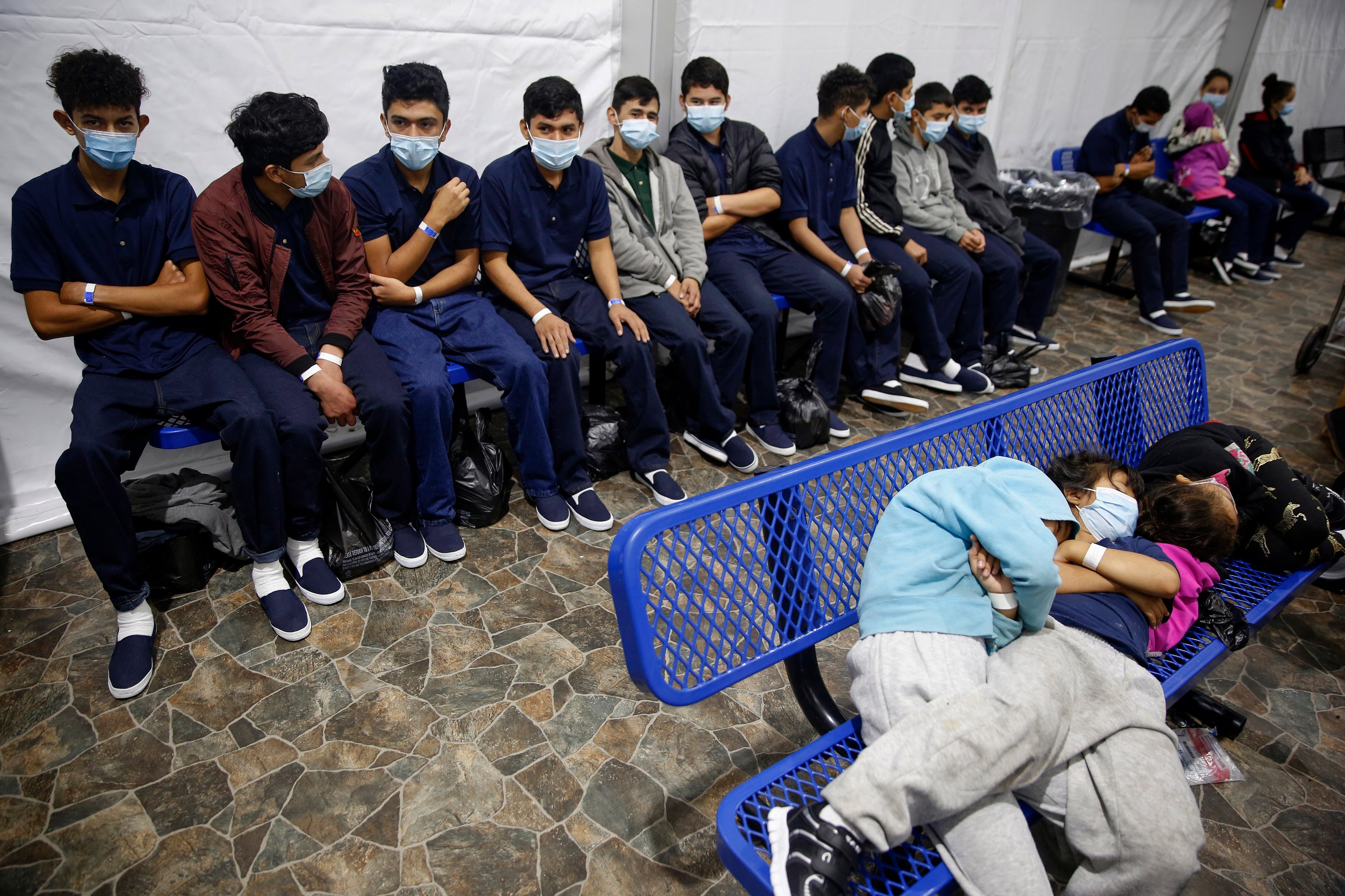This 2021 photo, during the Biden administration, shows young unaccompanied migrants waiting at a processing station inside a U.S. Customs and Border Protection facility in Texas.