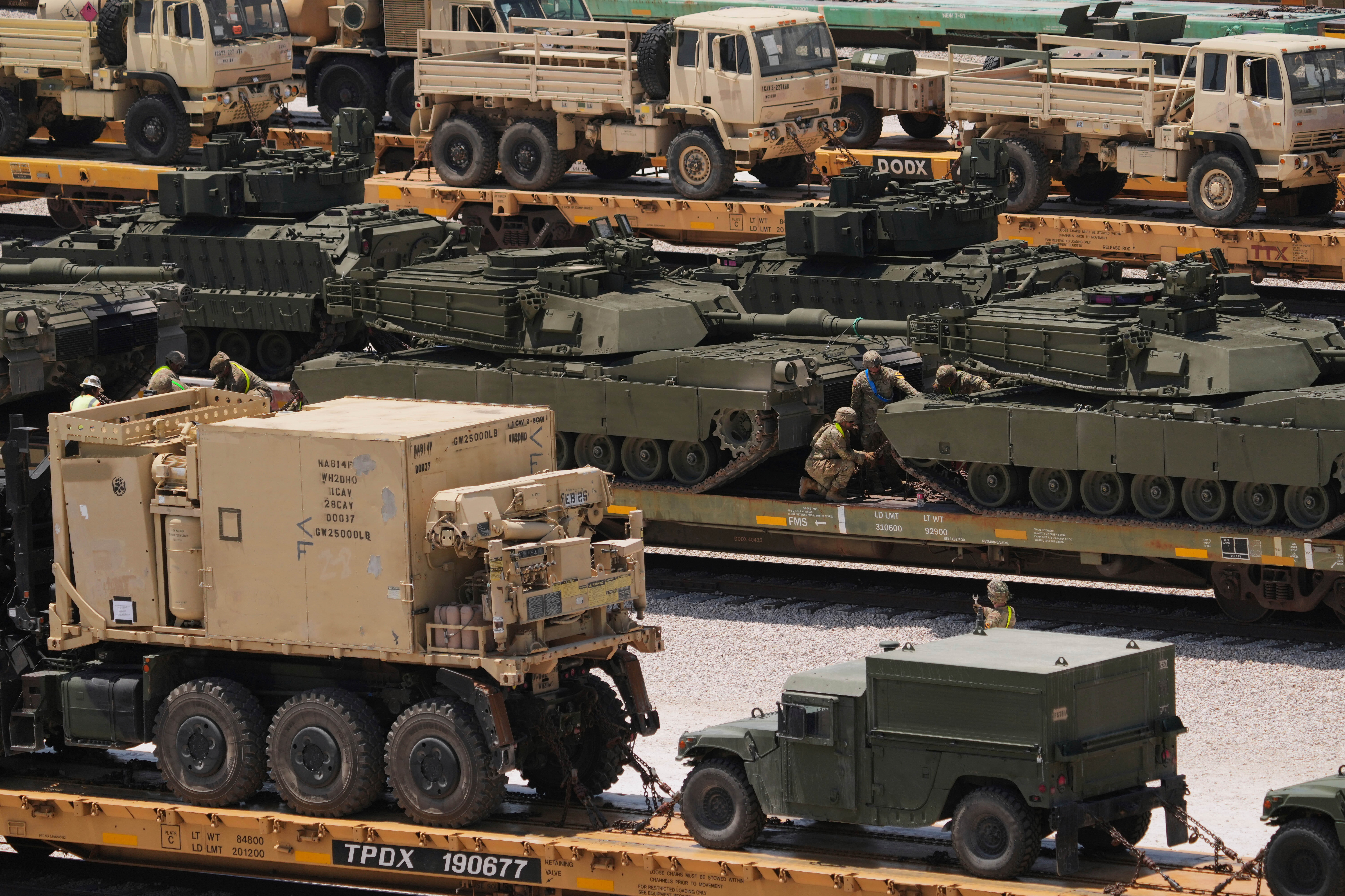 U.S. Army personnel load and secure military tanks for transport to Washington, D.C., Thursday, May 22, 2025, at Fort Cavazos near Killeen, Texas