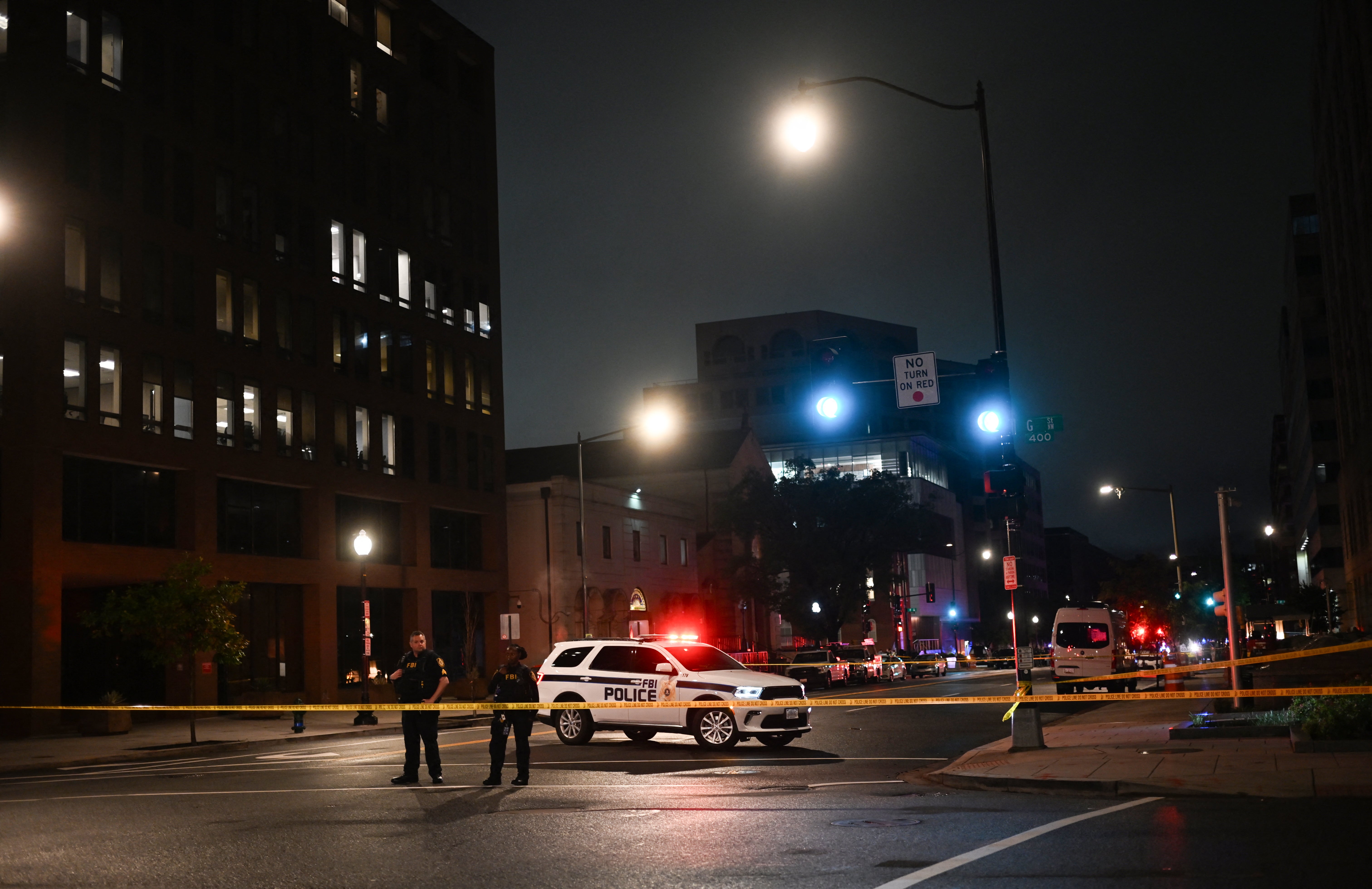 FBI agents cordon off the scene outside the Capital Jewish Museum following the shooting