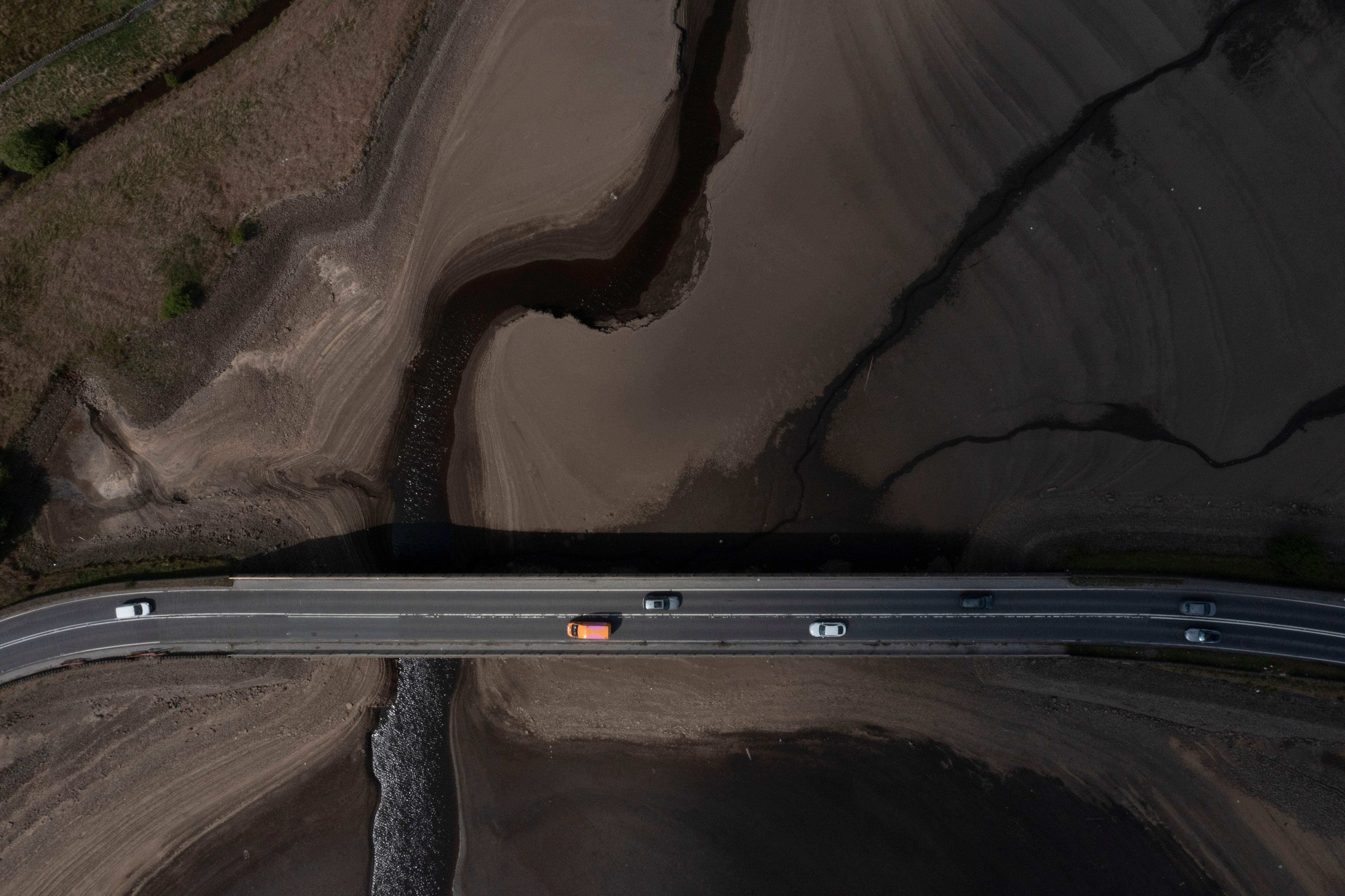 Traffic crosses a bridge at Woodhead Reservoir in Derbyshire as England experiences a significant drought