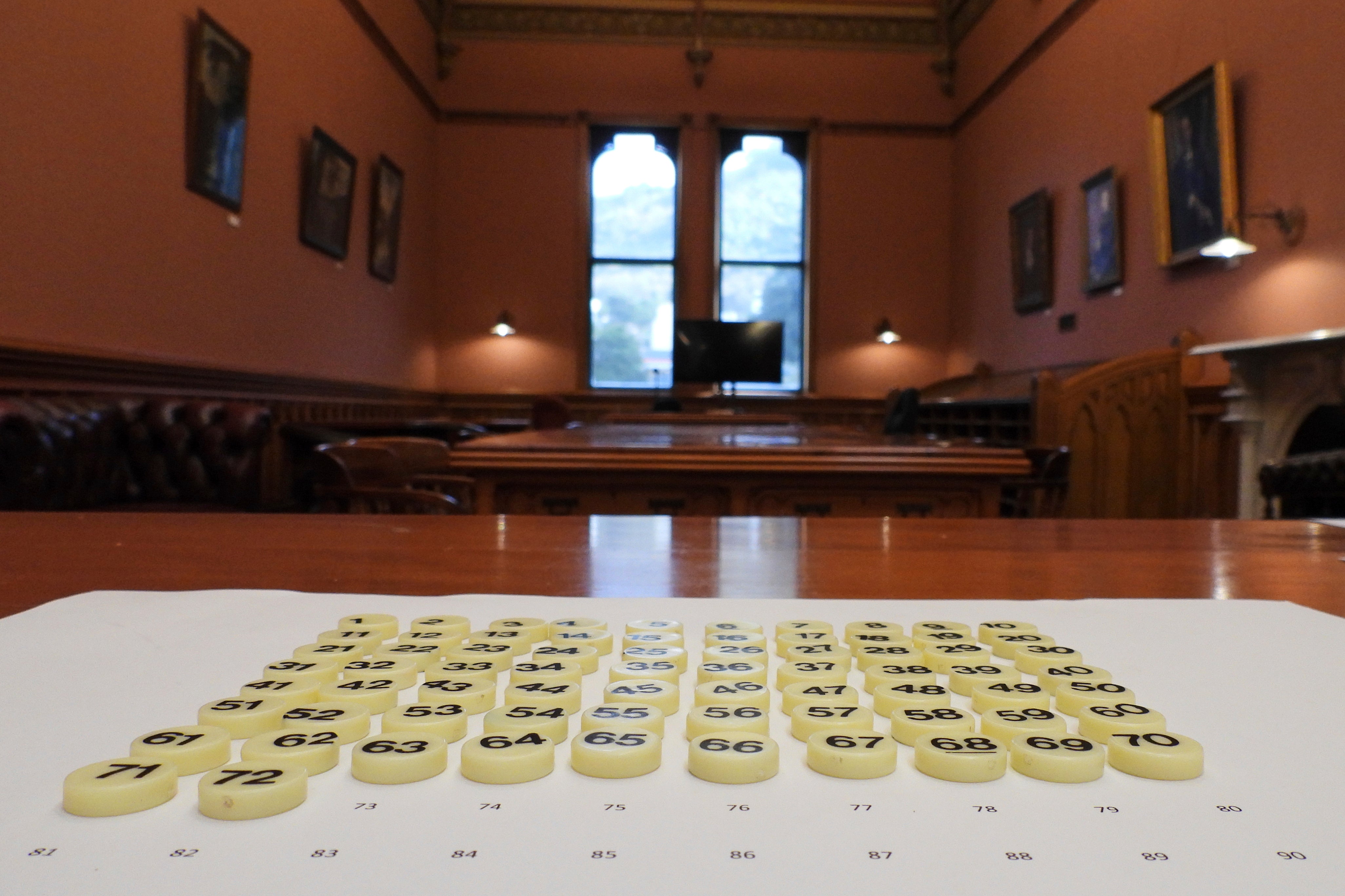 Bingo tokens, each representing a lawmaker's bill to be entered into the ballot, are laid out before the draw at Parliament in Wellington