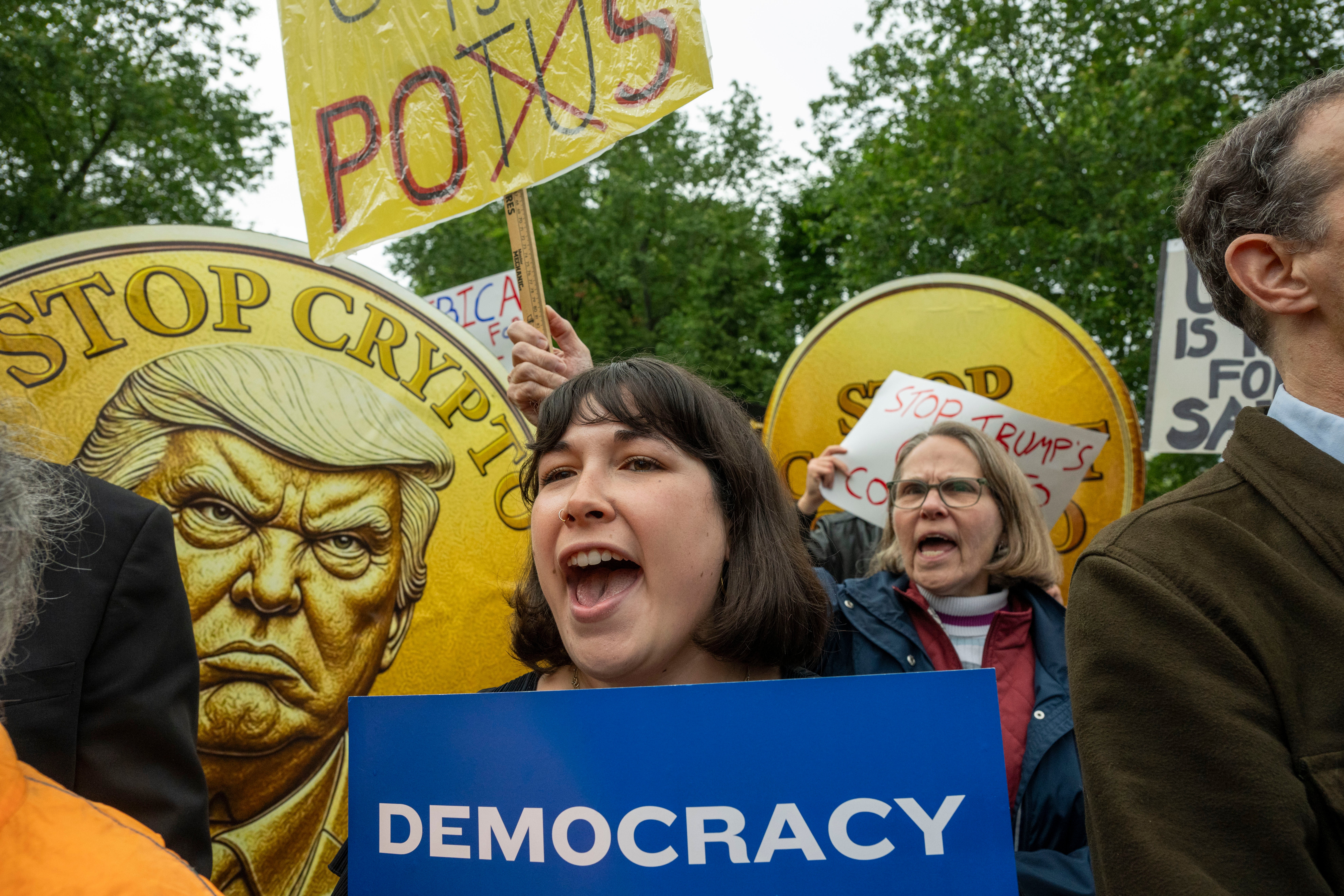 Around 100 protesters gathered outside Donald Trump’s National Golf Course club in Virginia ahead of a secretive dinner for investors in his cryptocurrency