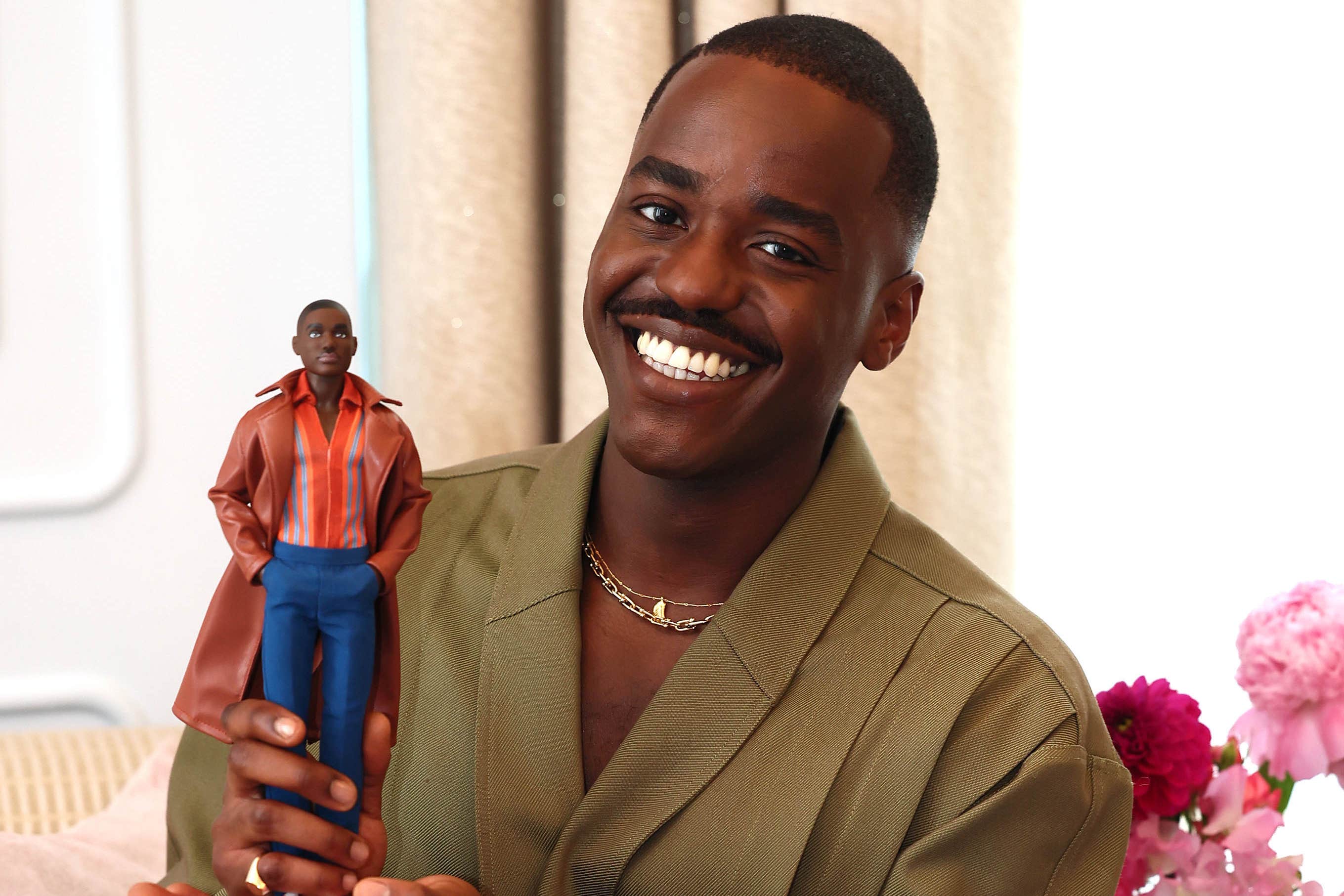 Ncuti Gatwa holding his Doctor Who Barbie Doll (Isabel Infantes/PA Media Assignments)