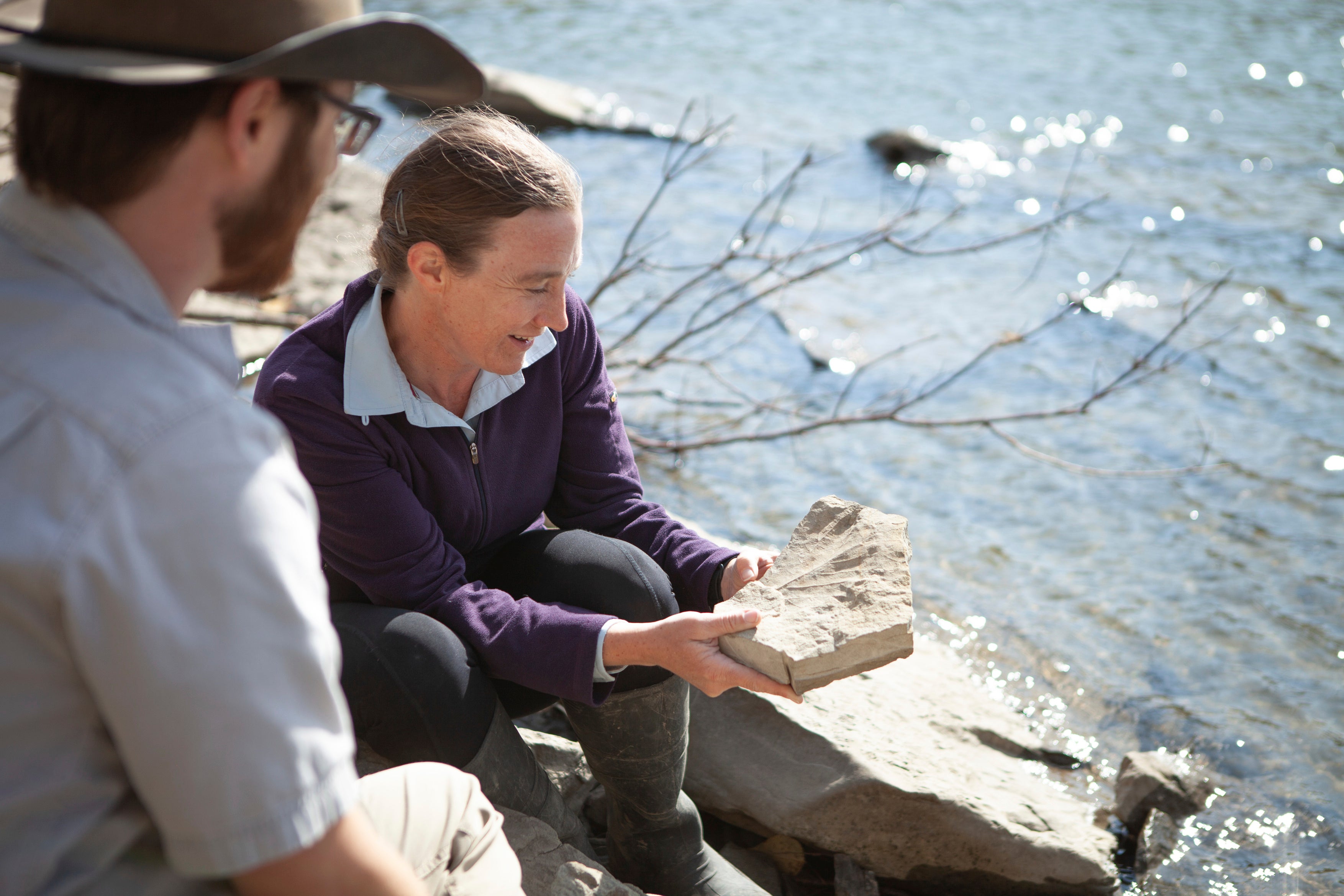 Emily Bamforth examining a leaf fossil