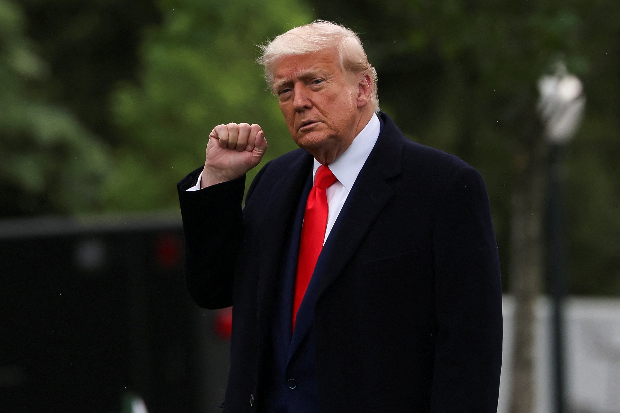 President Donald Trump, pictured leaving the White House Thursday to attend the dinner, schmoozed with the top purchasers of the coin at his golf course, amid accusations from Democrats that he is ‘cashing in’ on the presidency.