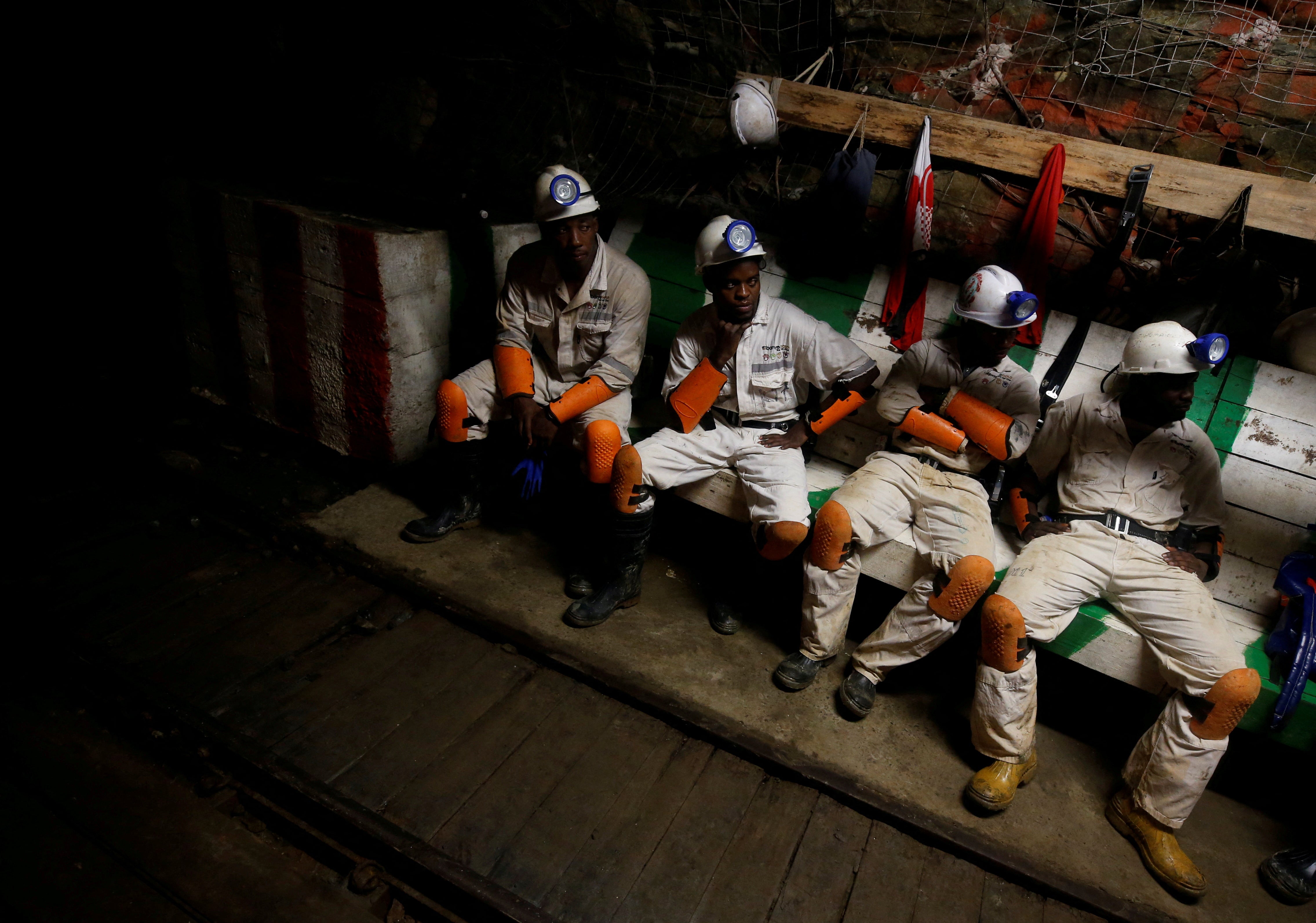 Miners take a break in a waiting area deep underground at Sibanye Gold's Masimthembe shaft in Westonaria, South Africa