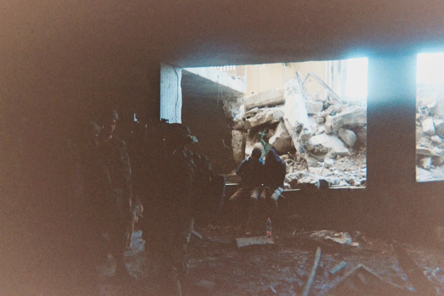 This photo provided by Breaking the Silence, a whistleblower group of former Israeli soldiers, shows two detainees used as human shields being held inside a house in the Gaza City area in 2024