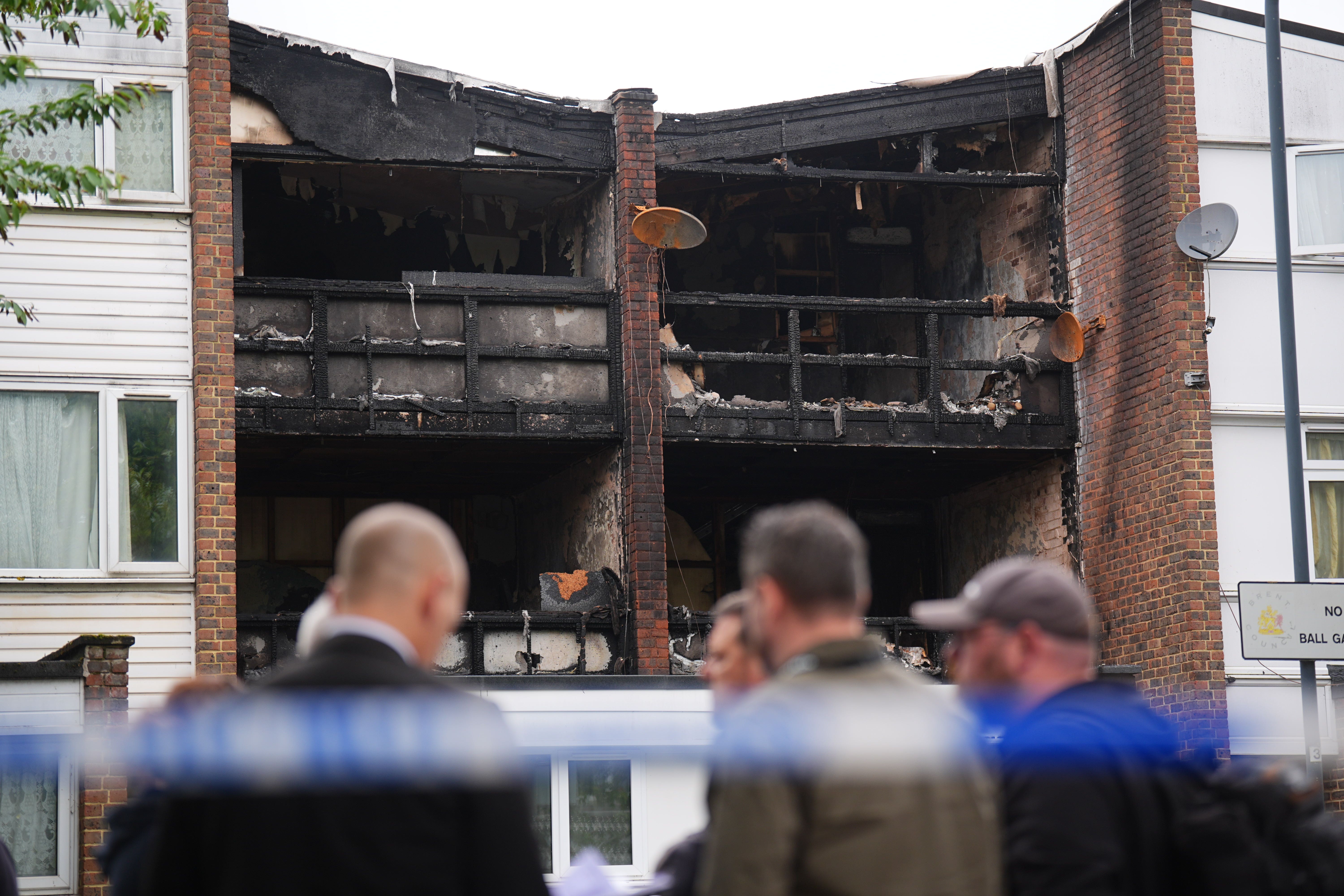 Investigators at the scene of the blaze on Saturday