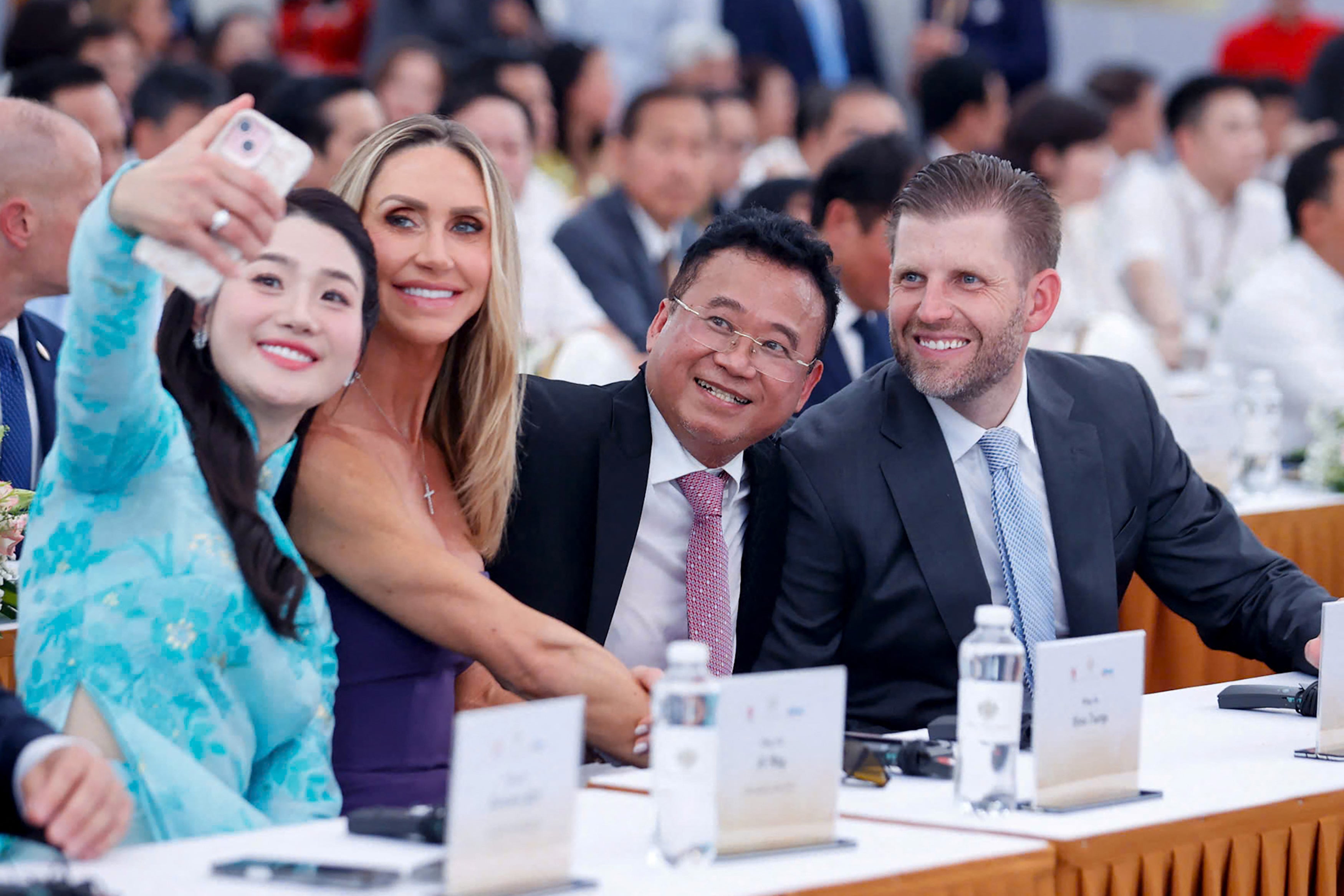 Eric Trump and his wife Lara pose for a selfie at the groundbreaking ceremony for the Trump International, Hung Yen resort and golf course project in Hung Yen province on May 21, 2025