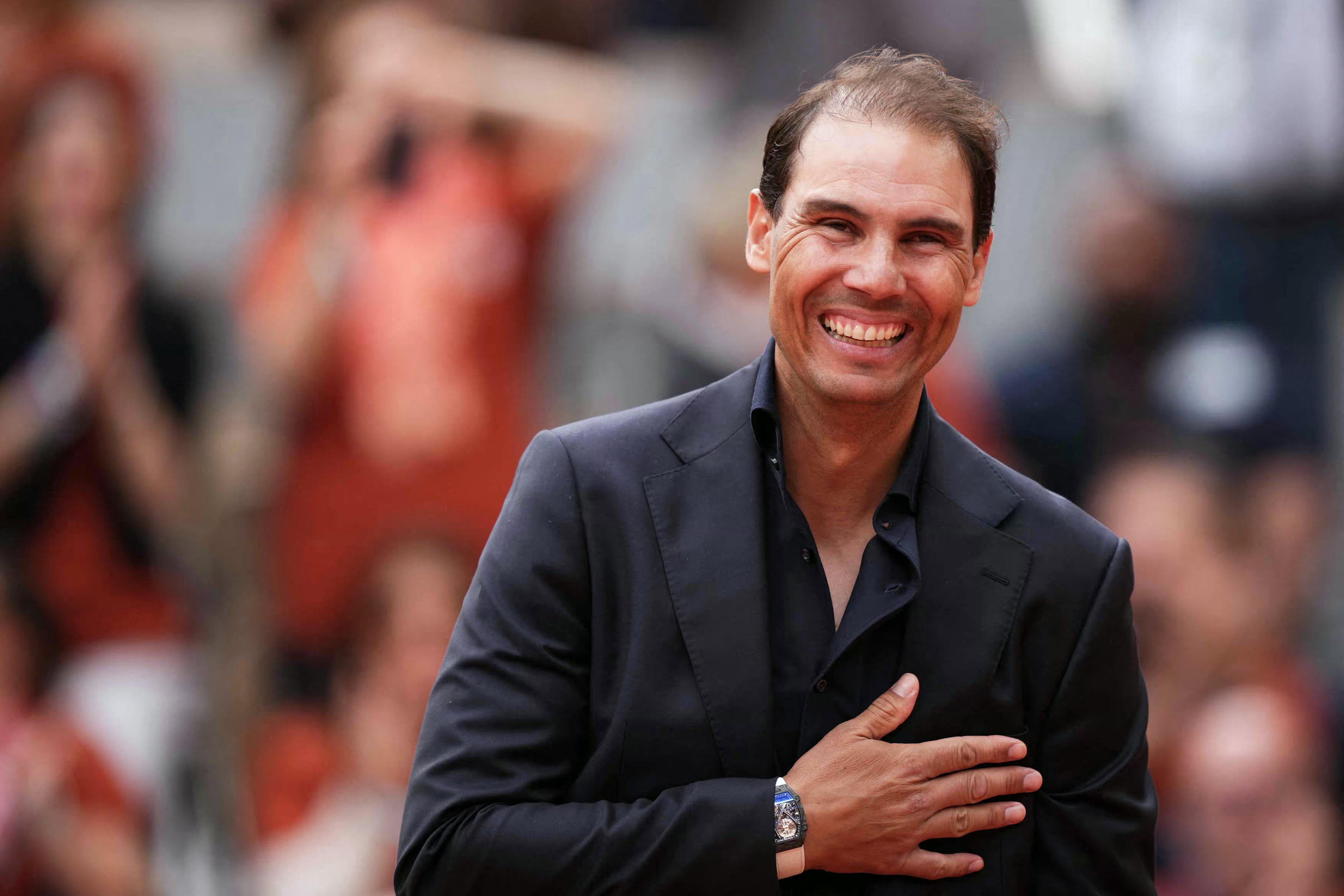 Former Spanish player Rafael Nadal gestures during a ceremony