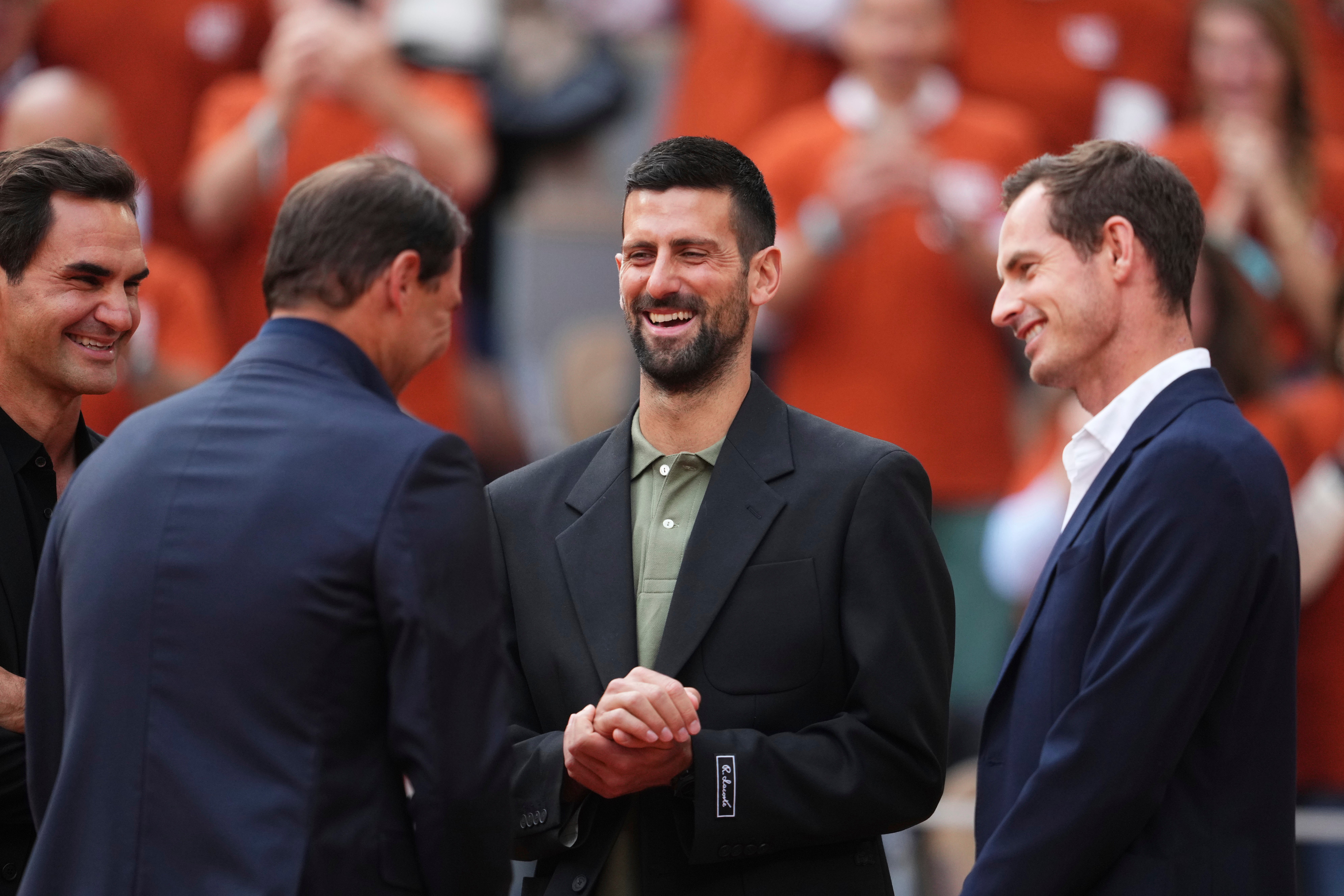 Rafa Nadal, second from left, is joined by Roger Federer, left, Novak Djokovic and Andy Murray, right, during a farewell ceremony