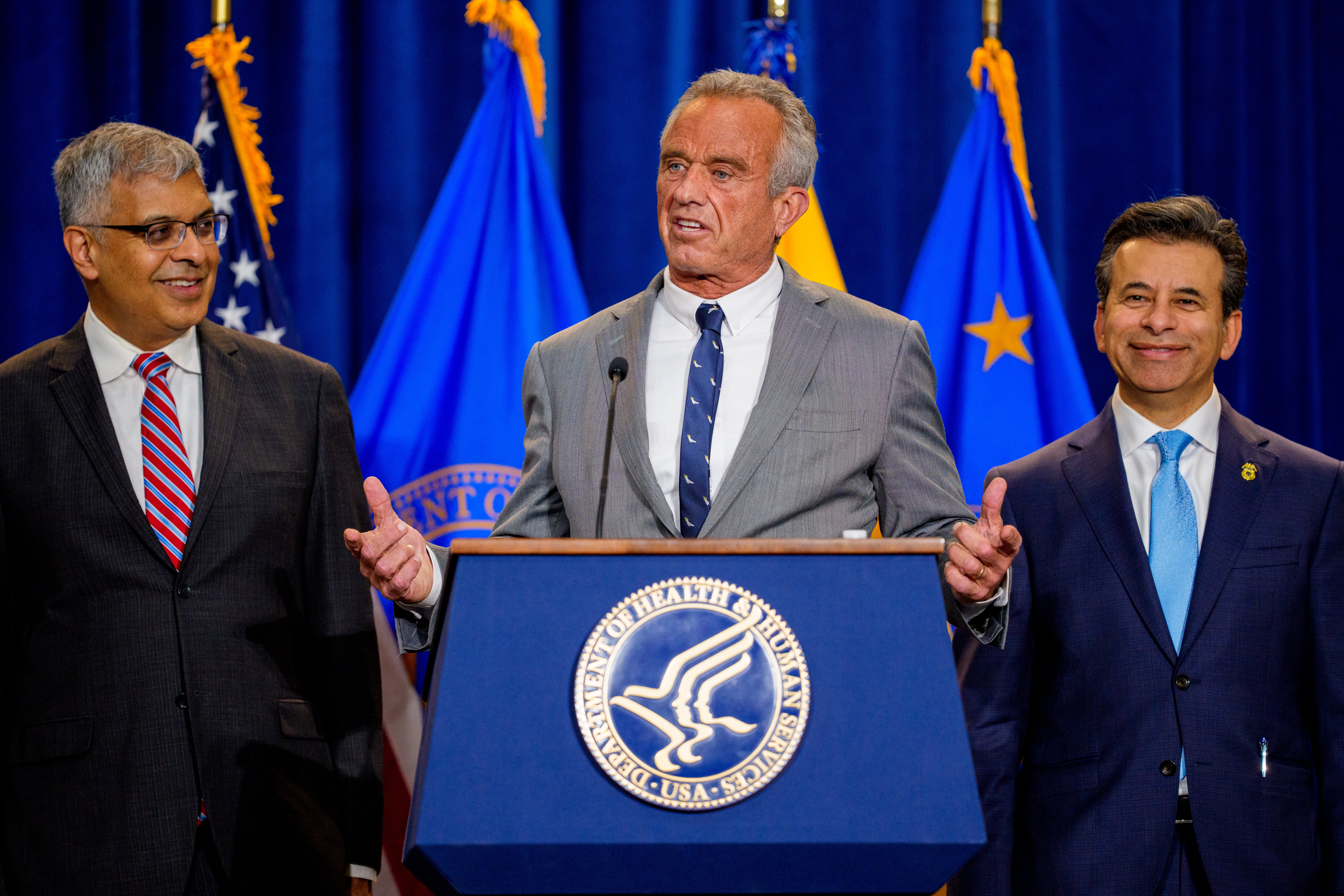 Health and Human Services Secretary Robert F. Kennedy Jr., accompanied by National Institutes of Health Director Jayanta Bhattacharya (L), and Food and Drug Administration Commissioner Marty Makary (R) speaks during a news conference at the Health and Human Services Department on April 22, 2025 in Washington, DC. Kennedy and Makary spoke about the intent of the FDA 