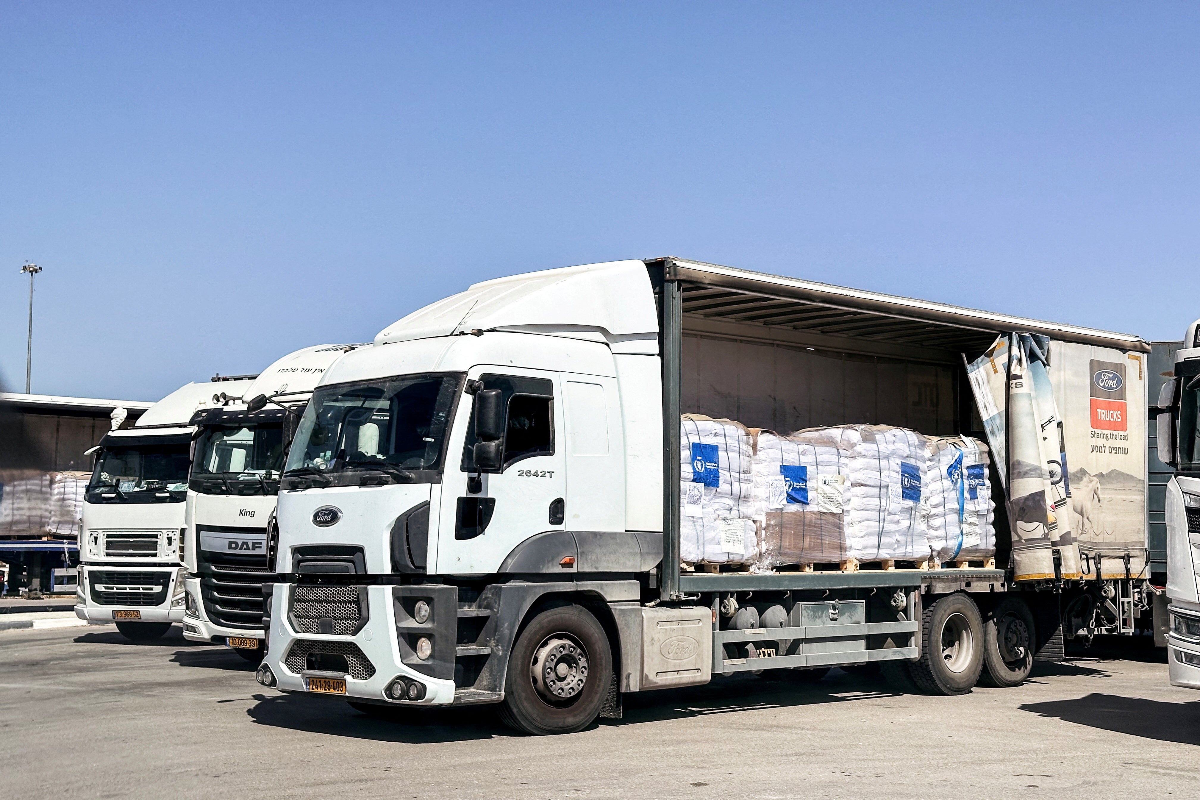 Trucks carrying aid are seen at the Kerem Shalom crossing between Israel and Gaza on its Israeli side on May 25