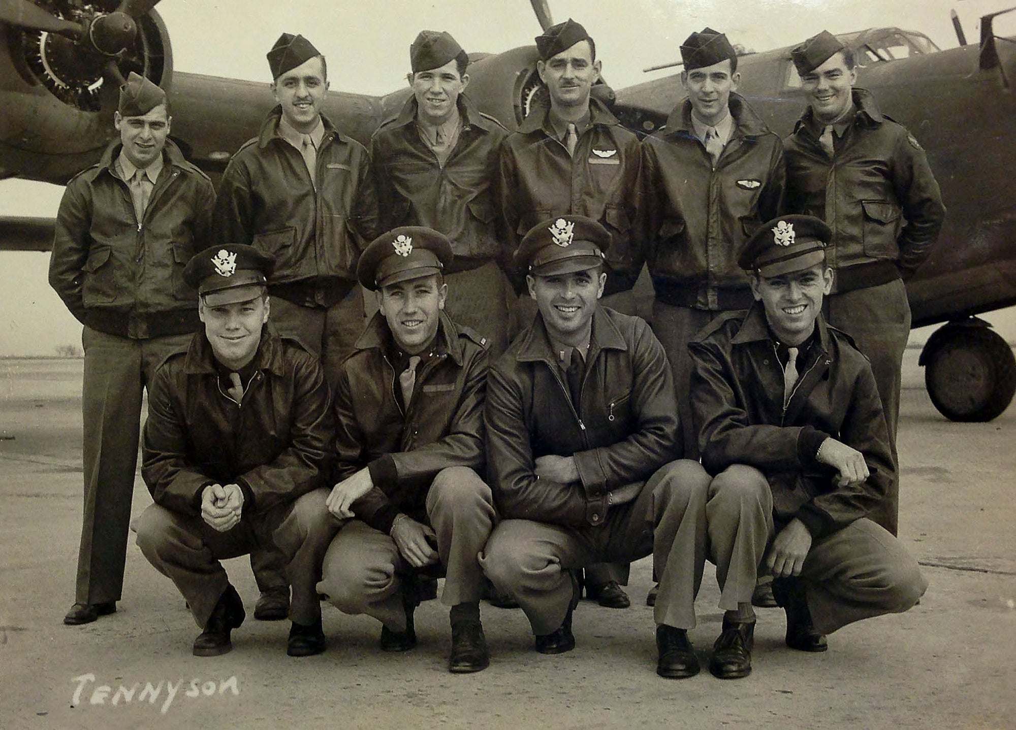 This 1943 photo shows 10 of the 11 members of the crew of the World War II B-24 bomber, Heaven Can Wait, that went down in the waters of Hansa Bay, Papua New Guinea in 1944, including Staff Sgt. Eugene Darrigan, top row second from right, and, bottom row from left, 2nd Lt. Donald Sheppick, 1st Lt. Herbert Tennyson, and 2nd Lt. Tomas Kelly, far right. (Defense POW/MIA Accounting Agency via AP)